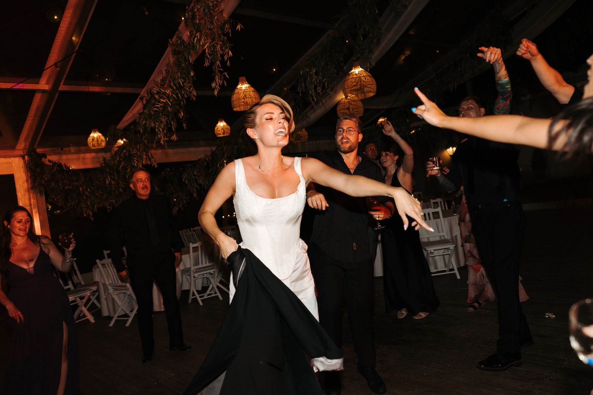 Bride dances happily during the reception of an intimate wedding in Portugal