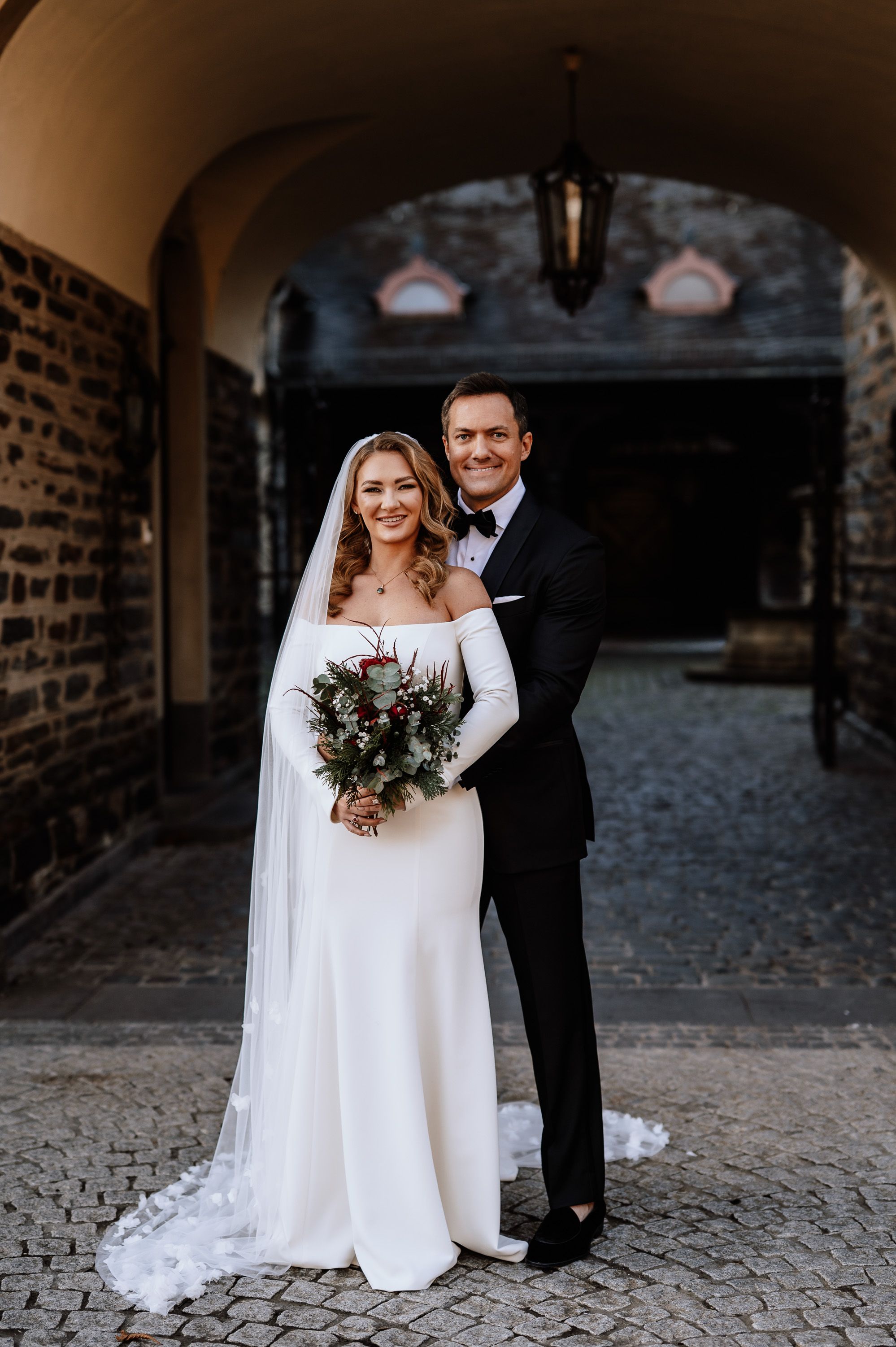 Bride and groom hug during the photoshoot of their small wedding in Germany