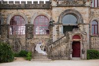 Medieval castle with a bride and groom having a photoshoot for their destination wedding in Portugal