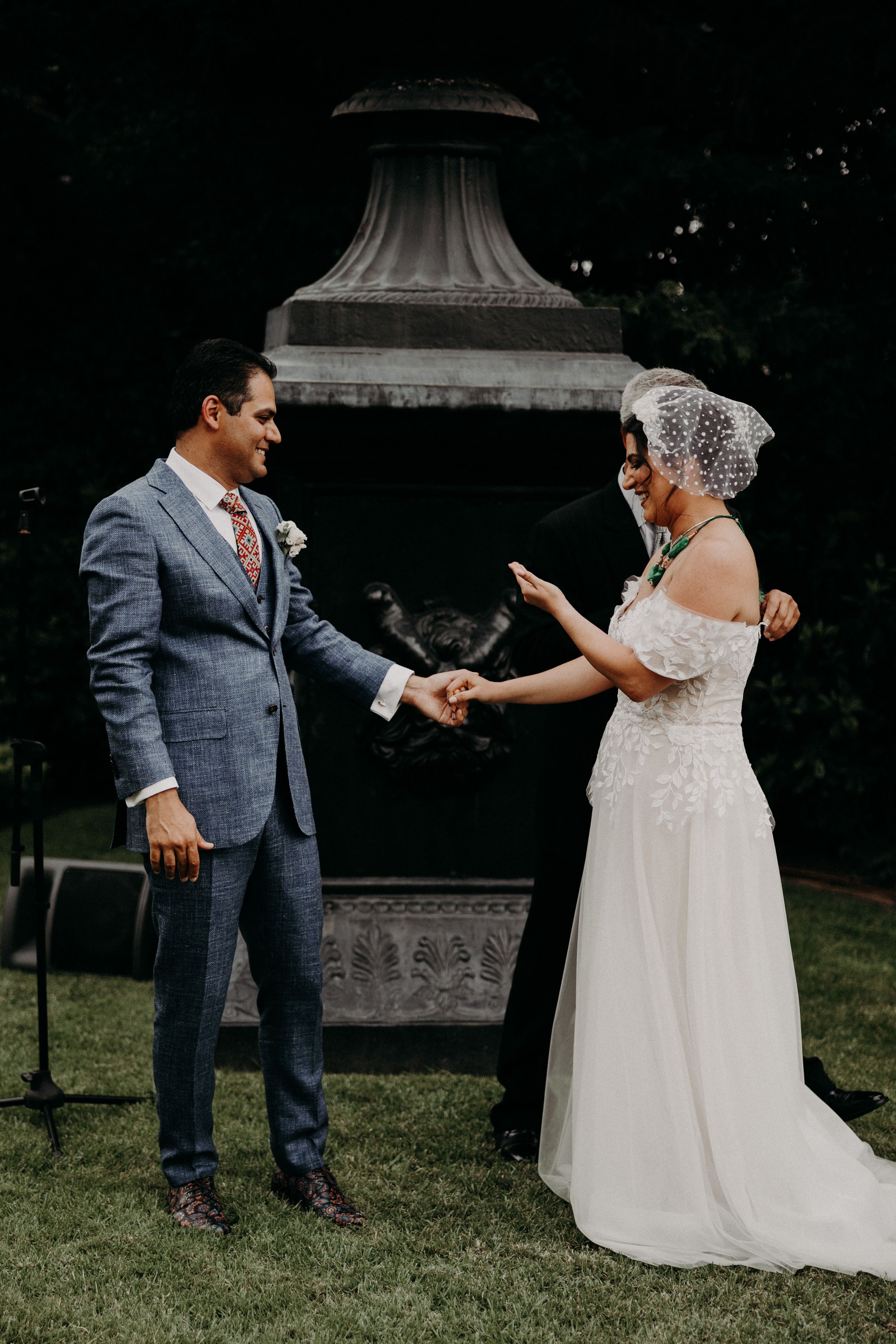 Bride reciting her vows to the groom in an outdoor ceremony for a destination wedding in Portugal