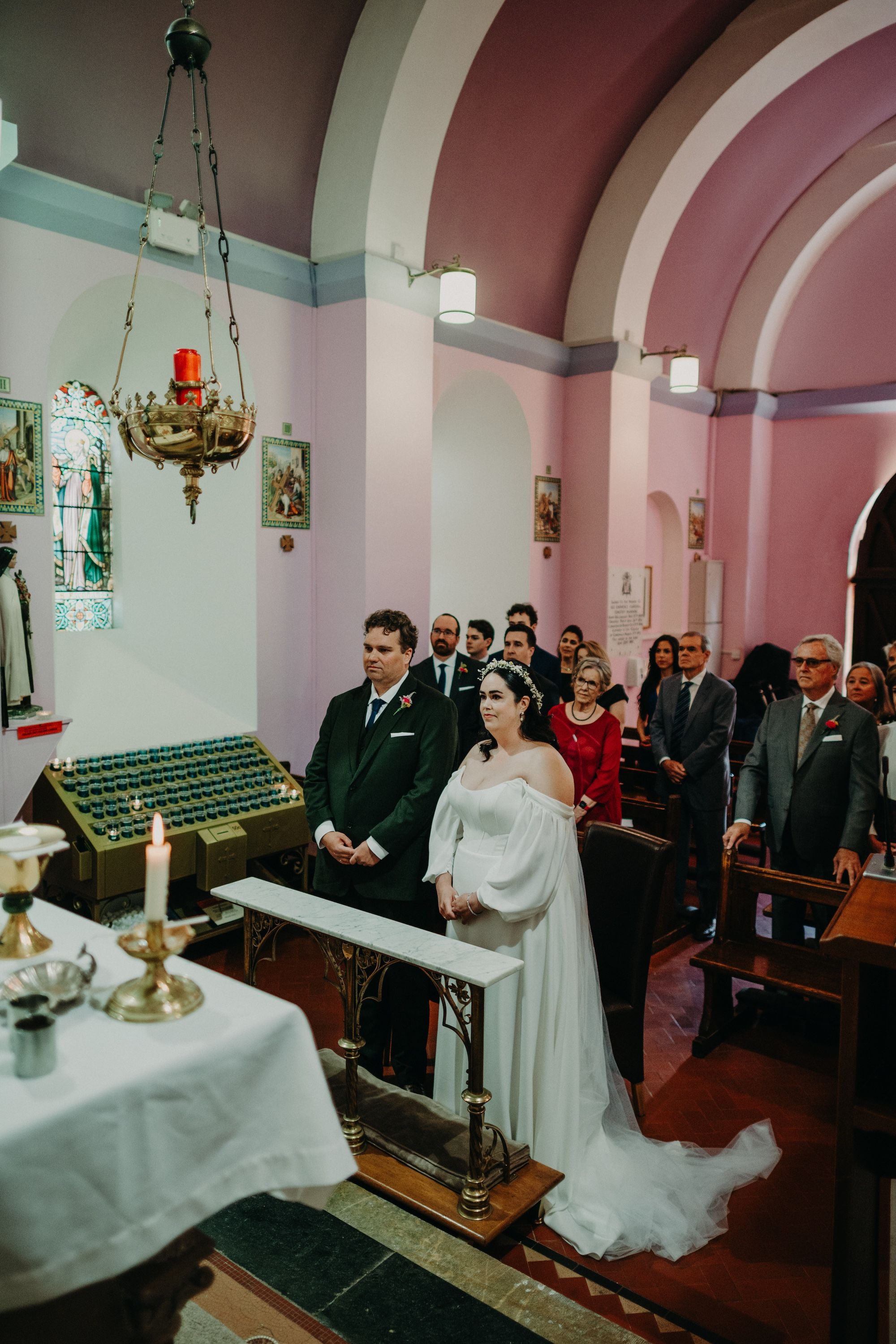 Bride and groom having a solemn ceremony inside a Catholic chapel in Cork during their intimate wedding in Ireland