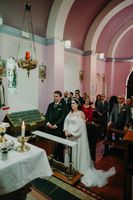 Bride and groom having a solemn ceremony inside a Catholic chapel in Cork during their intimate wedding in Ireland