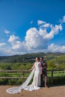 Bride and groom having a photoshoot for their destination wedding in Spain with a Barcelona countryside backdrop