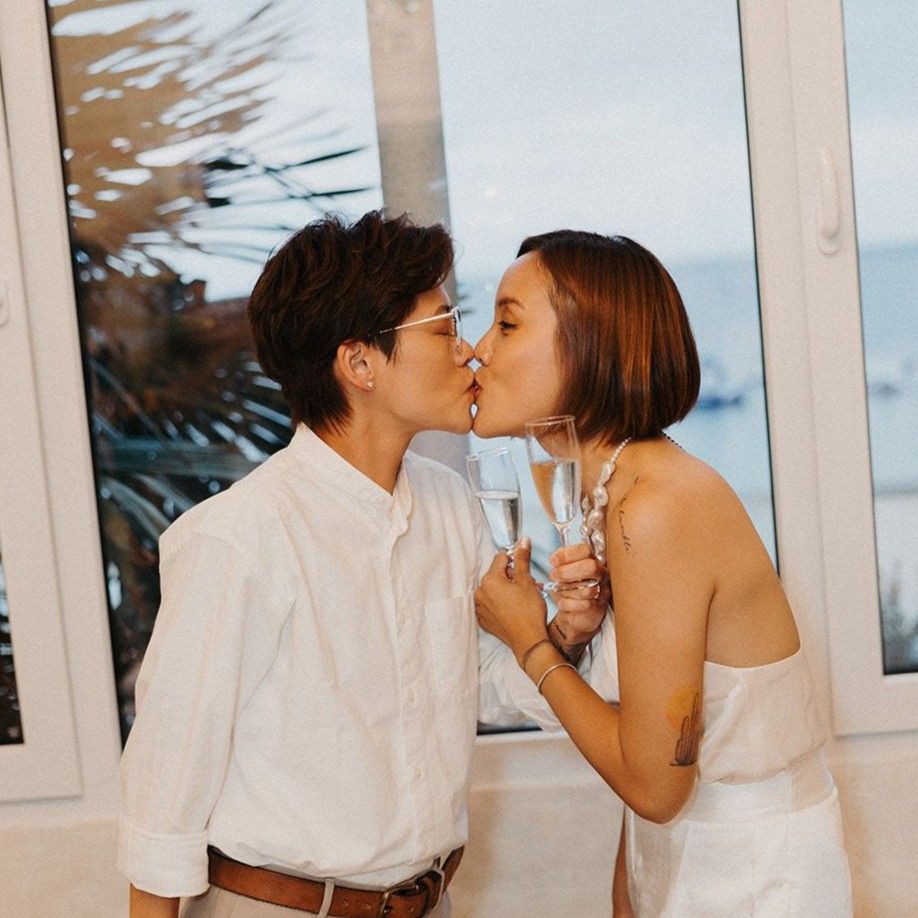 Same sex couple kissing on their wedding day