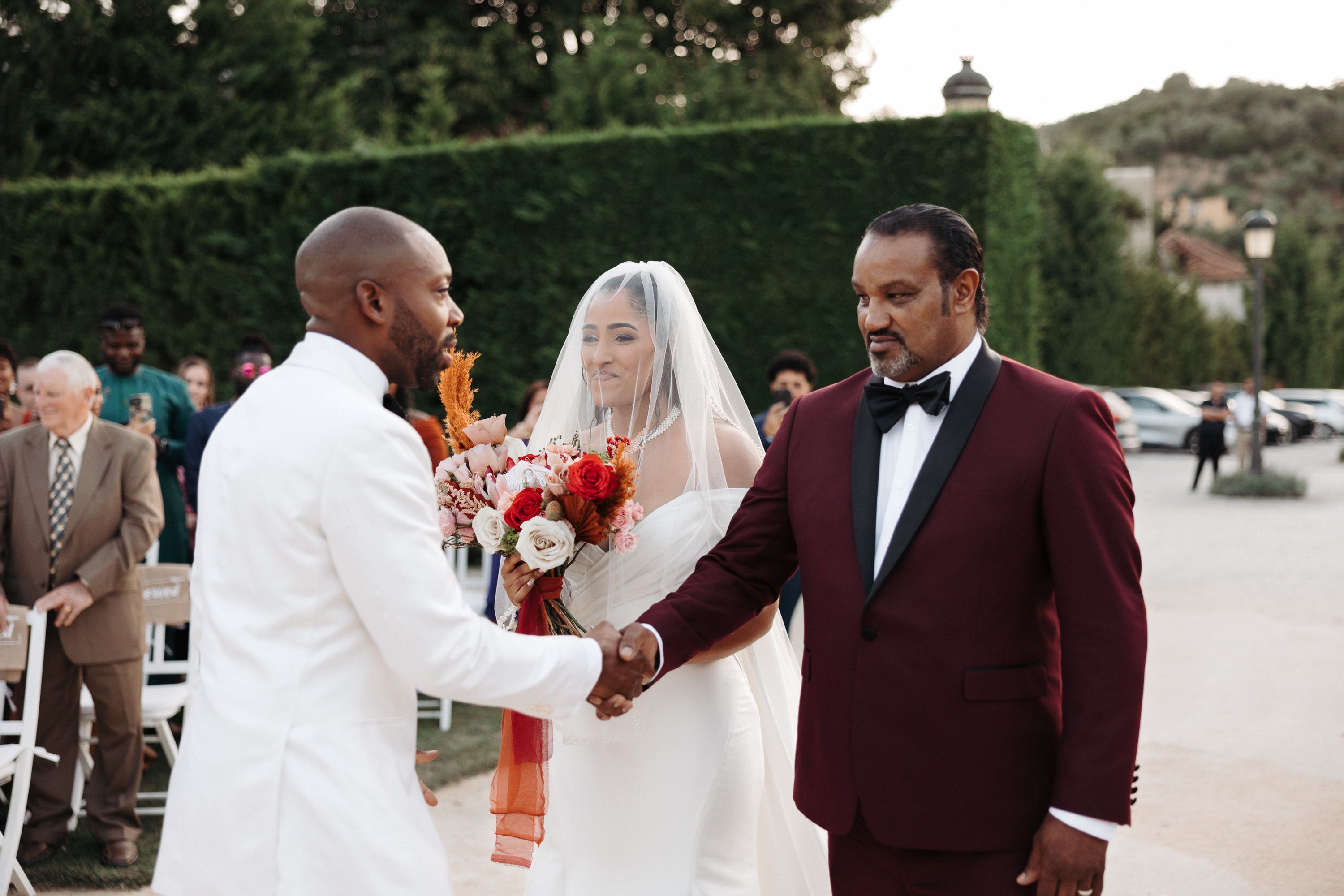 Father of the bride shaking hands with the groom during an intimate wedding in Portugal ceremony