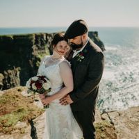 Bride and groom posing at at Hag's Head on their wedding day