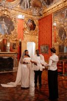 Bride and groom having a wedding ceremony inside a museum in Turin during their elopement in Italy