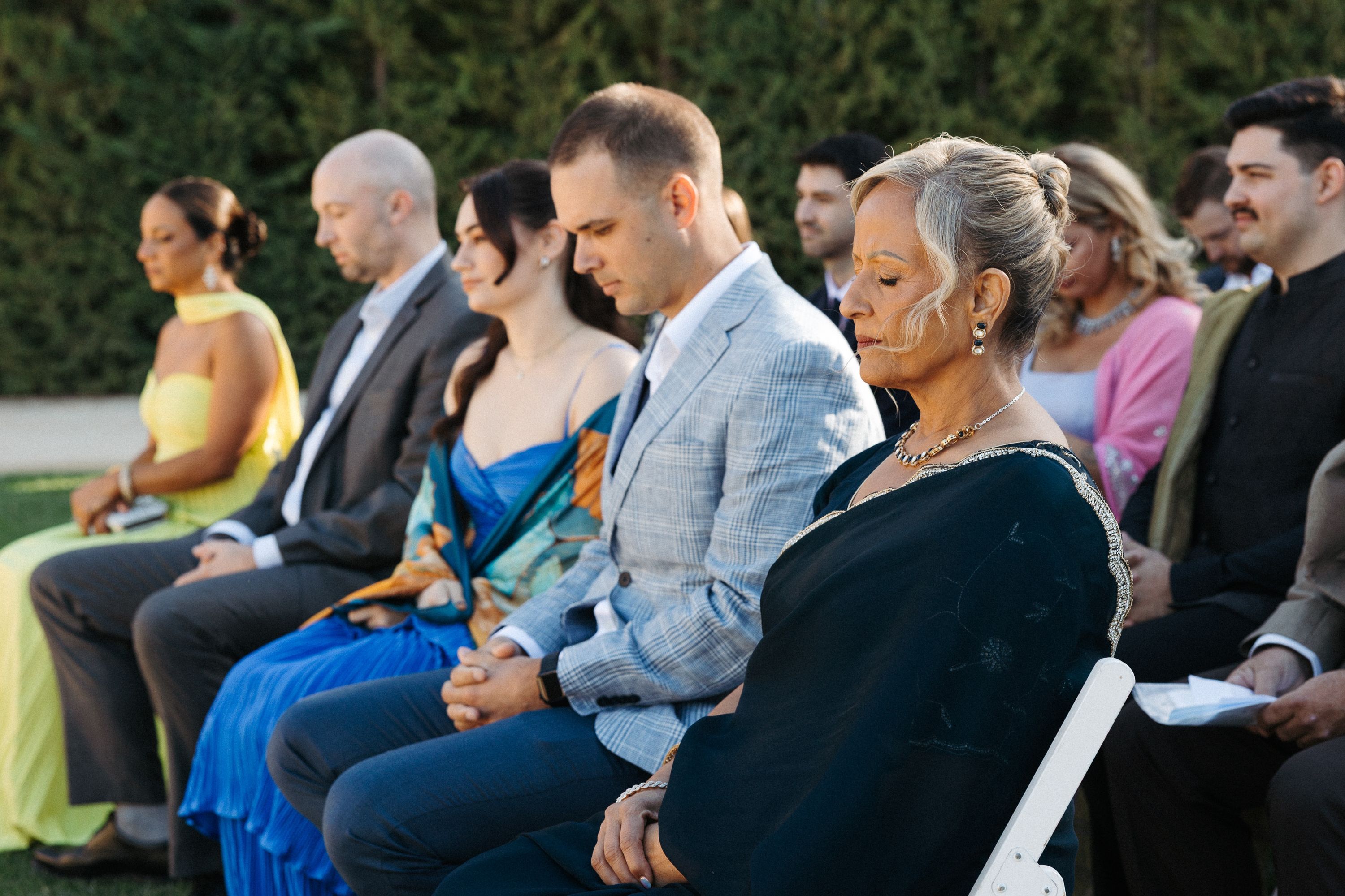 Wedding guests attentively seated during a small wedding in Portugal outdoor ceremony