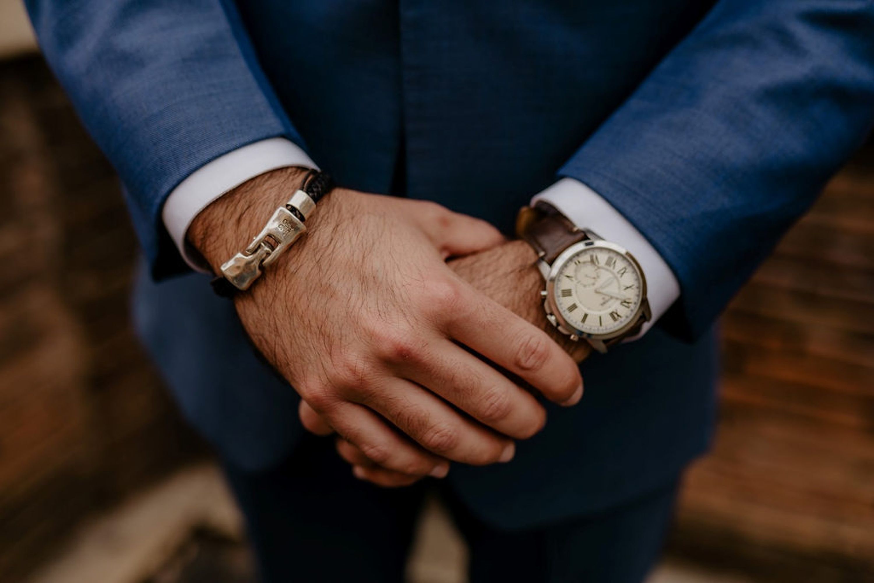 A groom wearing a piece of iron on his bracelet as Toc Ferro for his small wedding in Italy