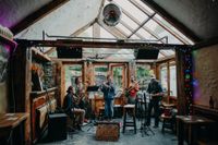 A band playing in a pub for the party of an intimate wedding in Ireland