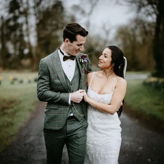 Bride and groom holding hand at their destination wedding in Ireland