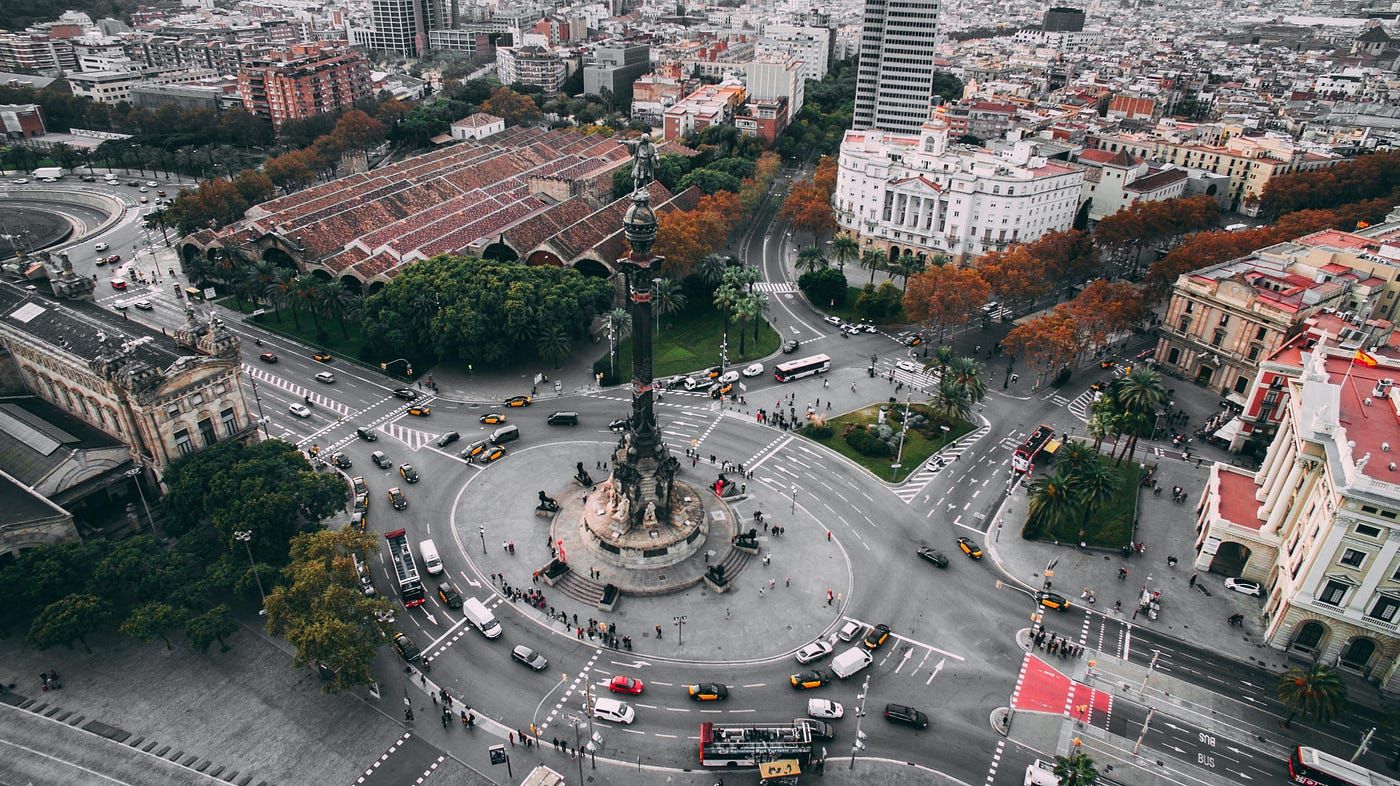 Barcelona city center showing busy roads with vehicles traversing and historic buildings along the road