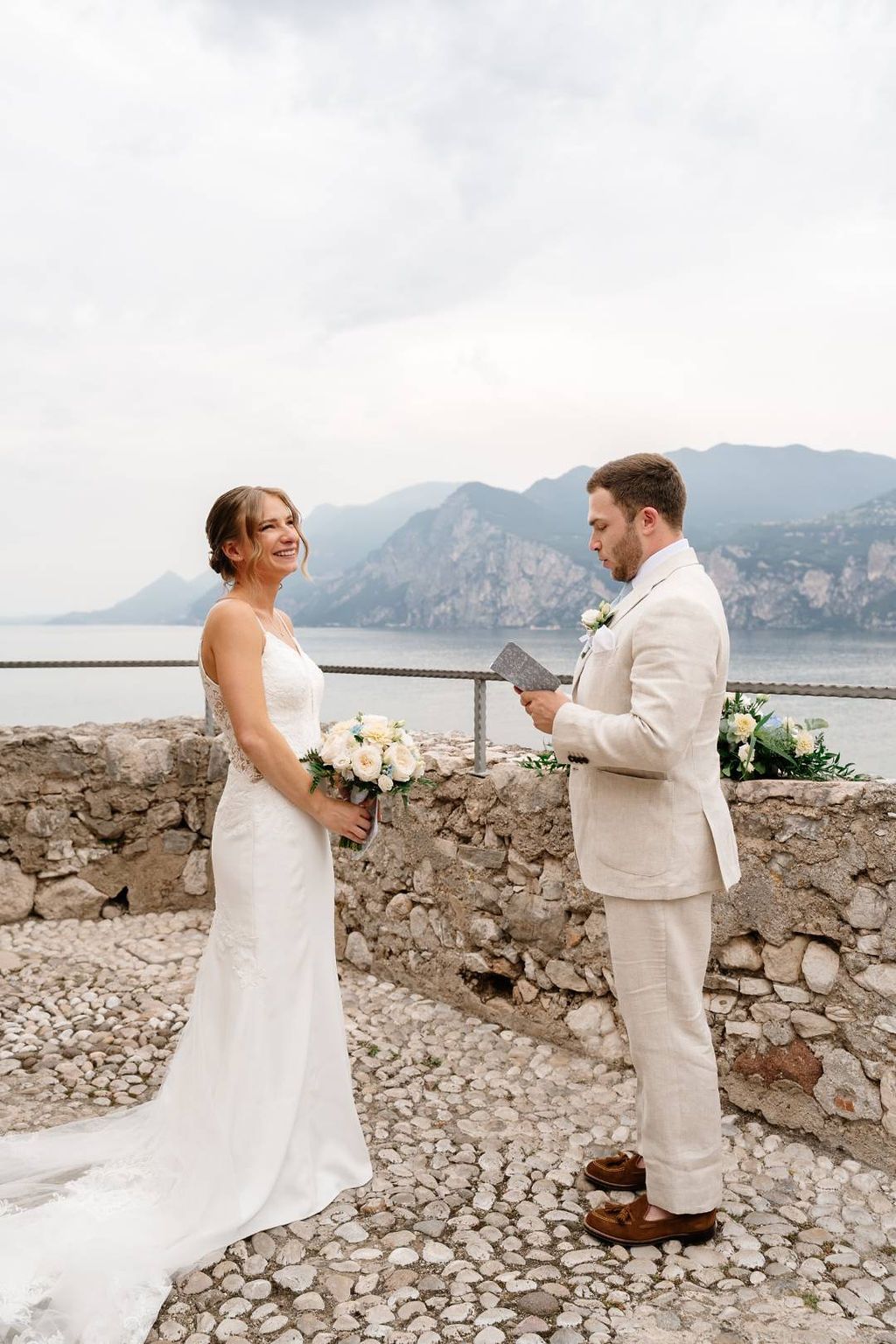 A terrace ceremony of an elopement for two in Italy overlooking Lake Garda