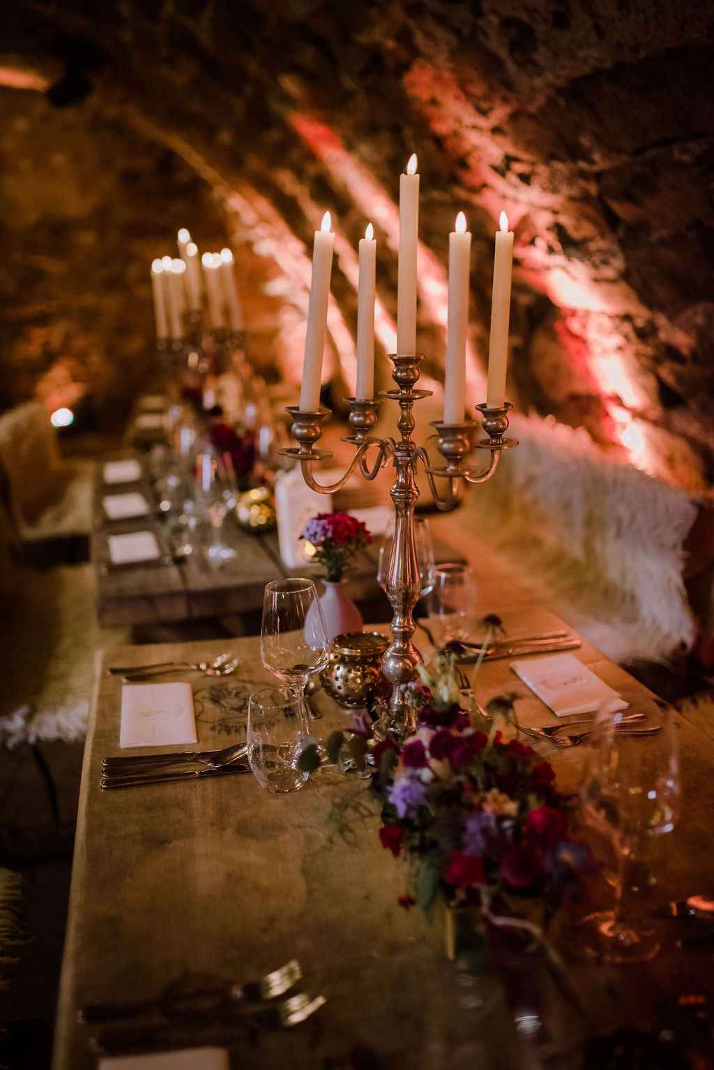 A reception table setup filled with candles for a small wedding in Germany