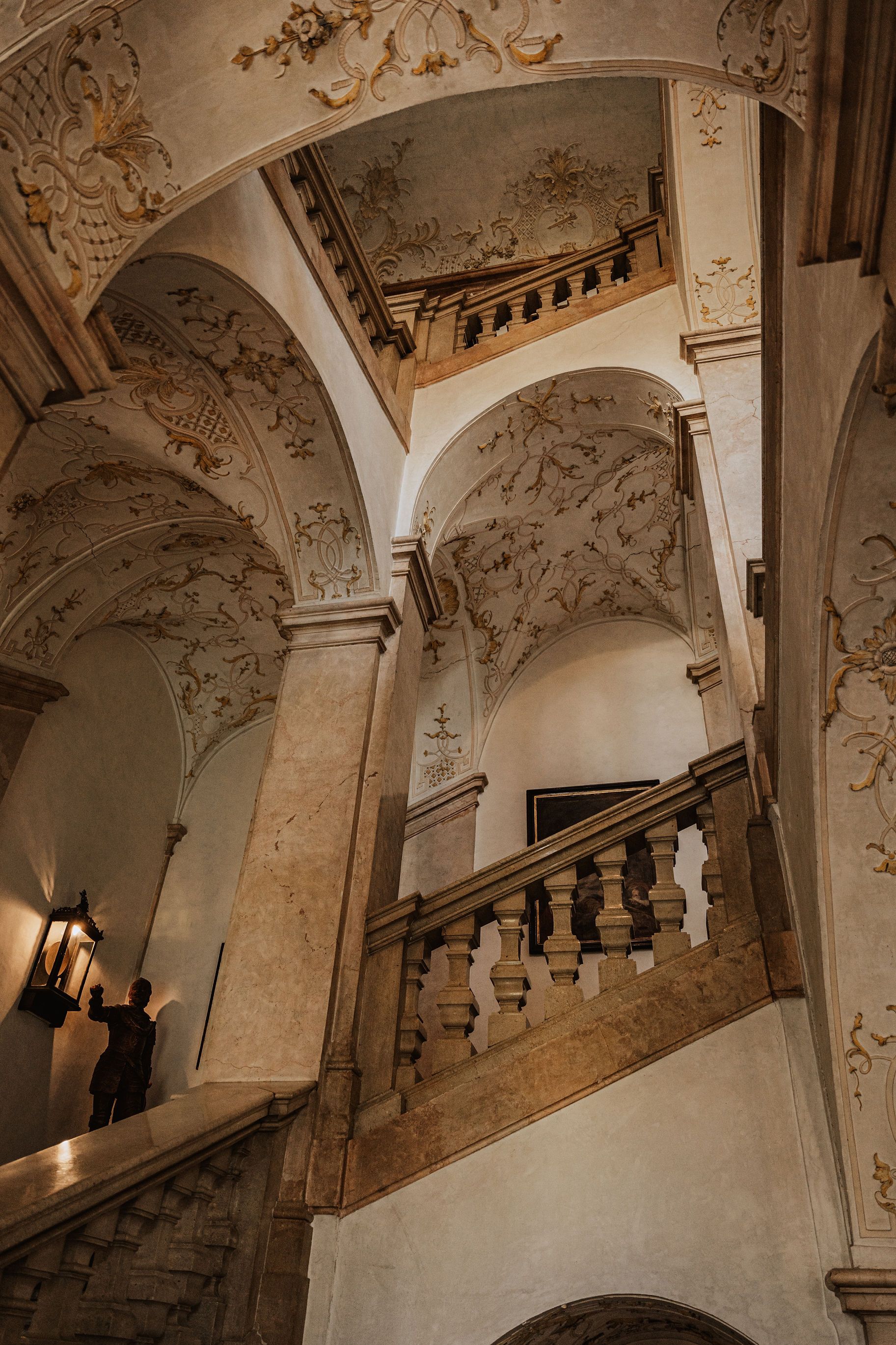 Sweeping baroque stone staircase inside an Austrian palace