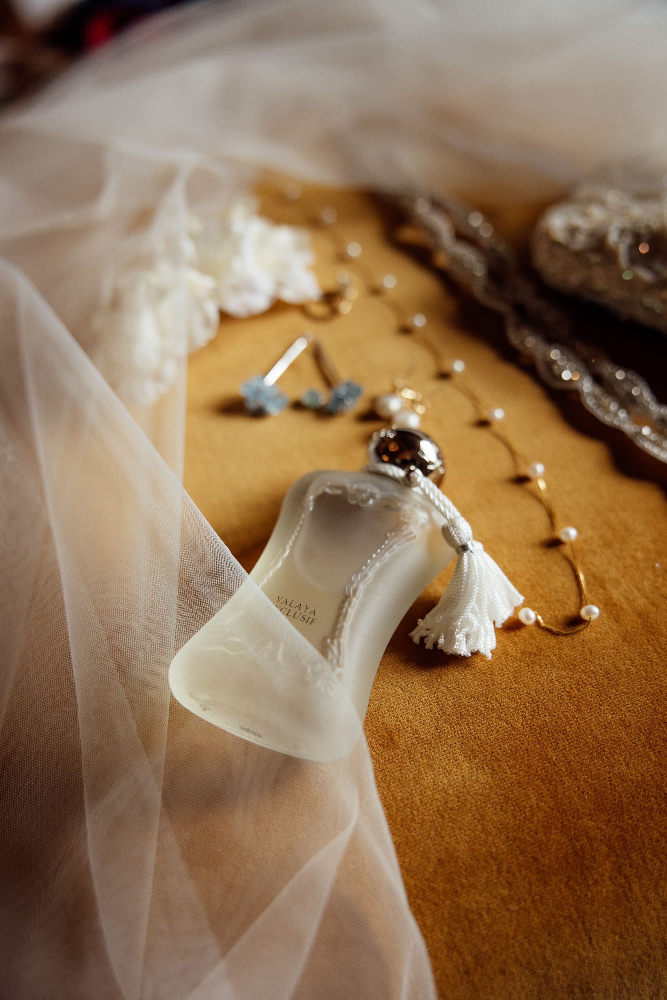 Bridal perfume, veil and accessories arranged beautifully for a small wedding in Austria