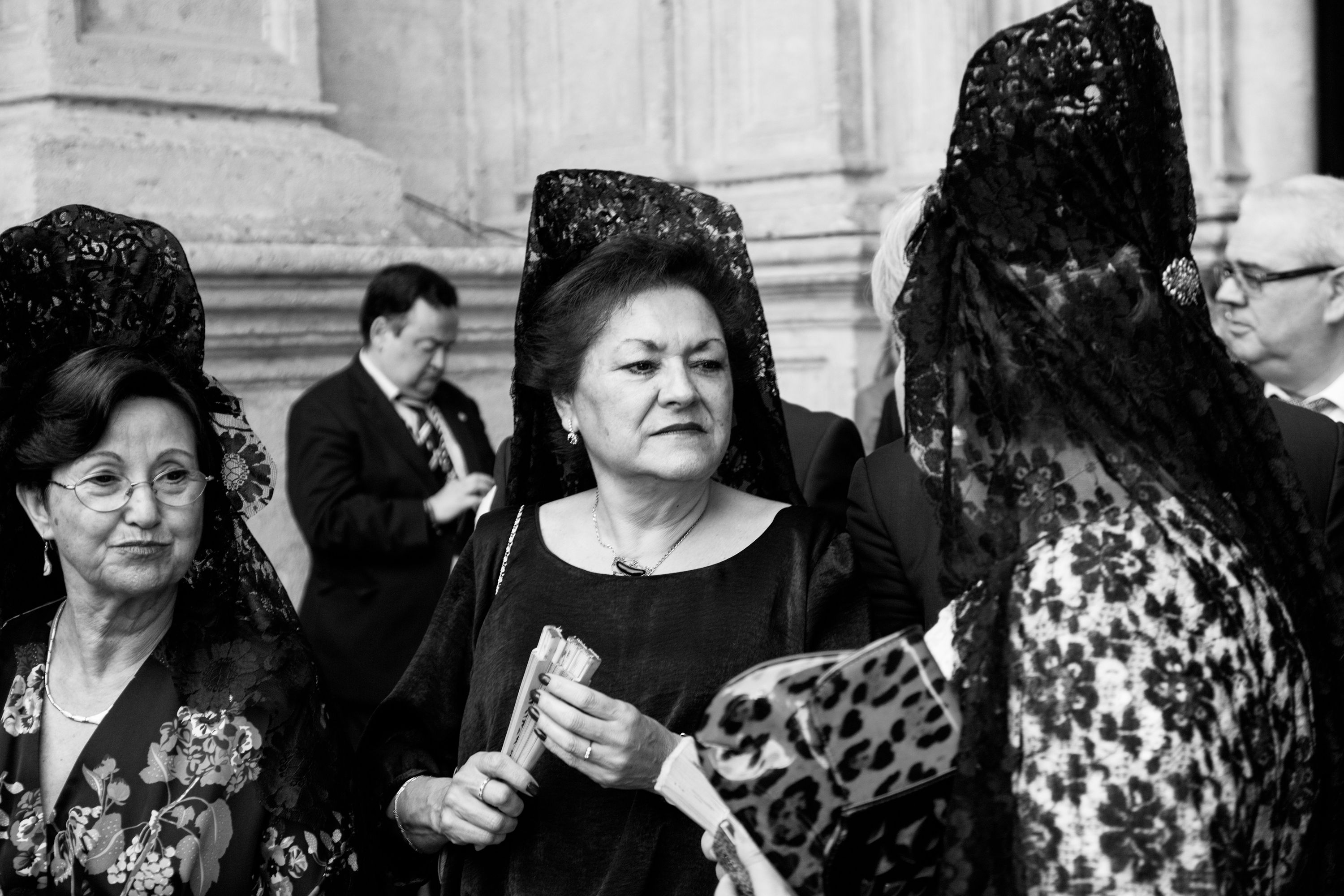 Black and white photo of women in Spanish veils