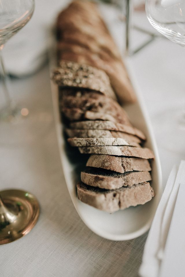 bread on a light table set for a wedding