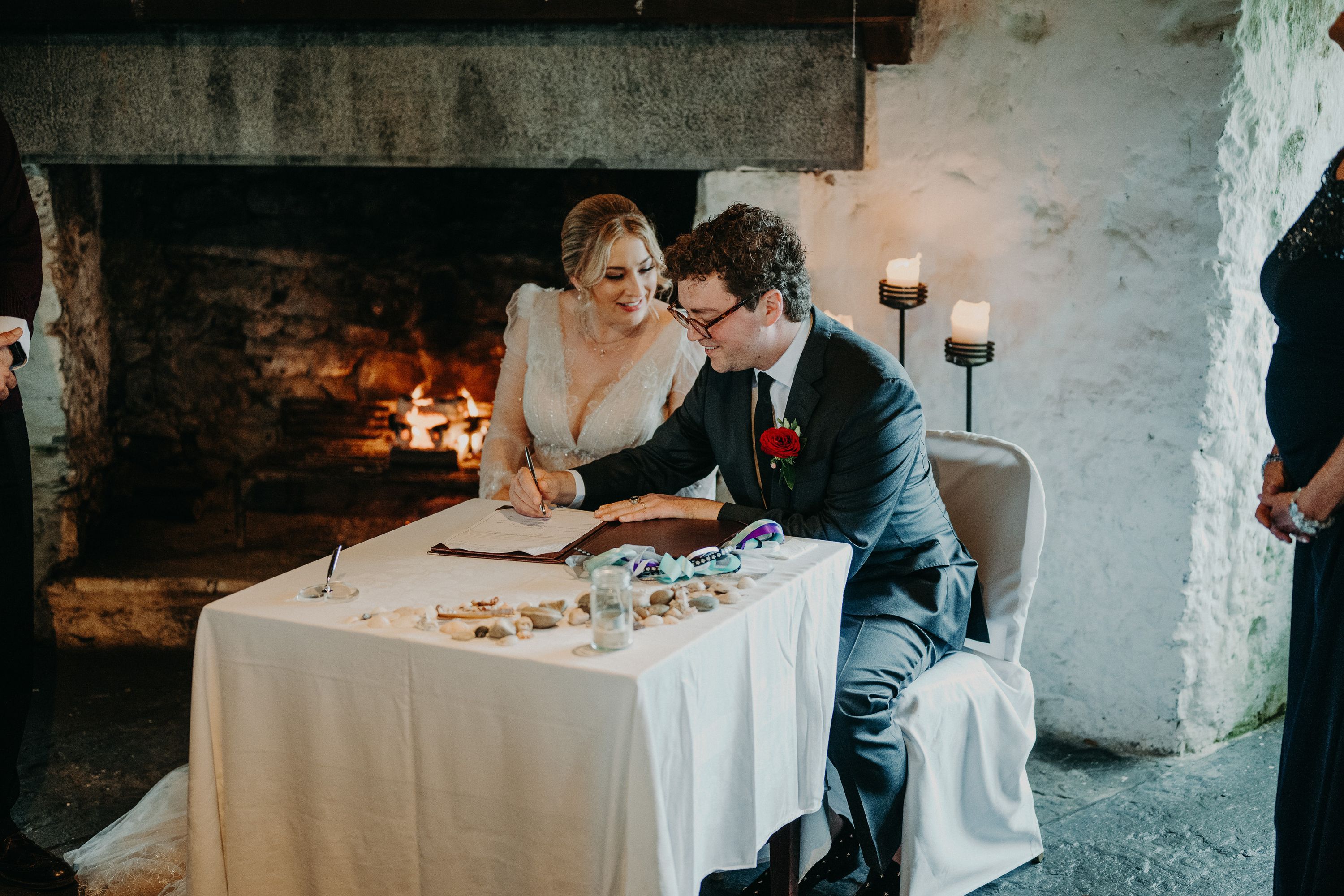 Groom signing the marriage register during an intimate wedding in Ireland celebration