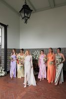 Bride in her wedding dress with her bridesmaids during the photoshoot of her destination wedding in Portugal
