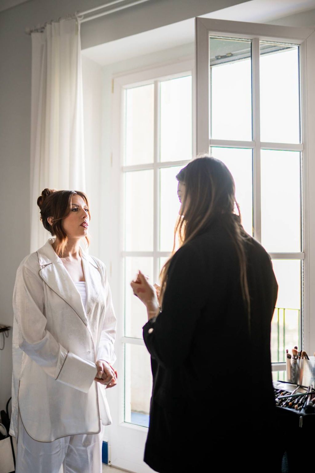 Bride talking to her destination wedding planner in Italy while getting ready for her Italian vow renewal