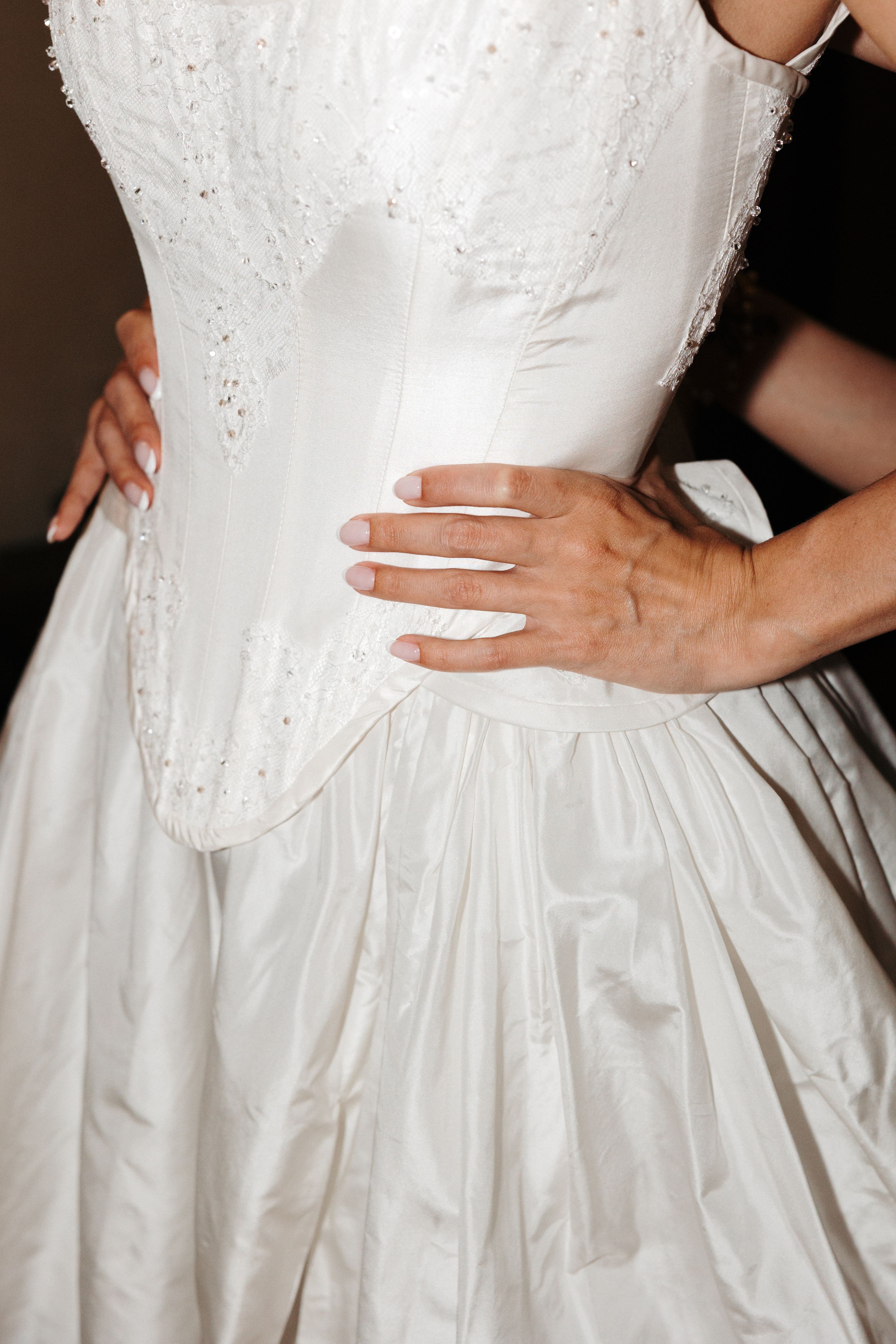 White wedding dress closeup of a corsetted dress