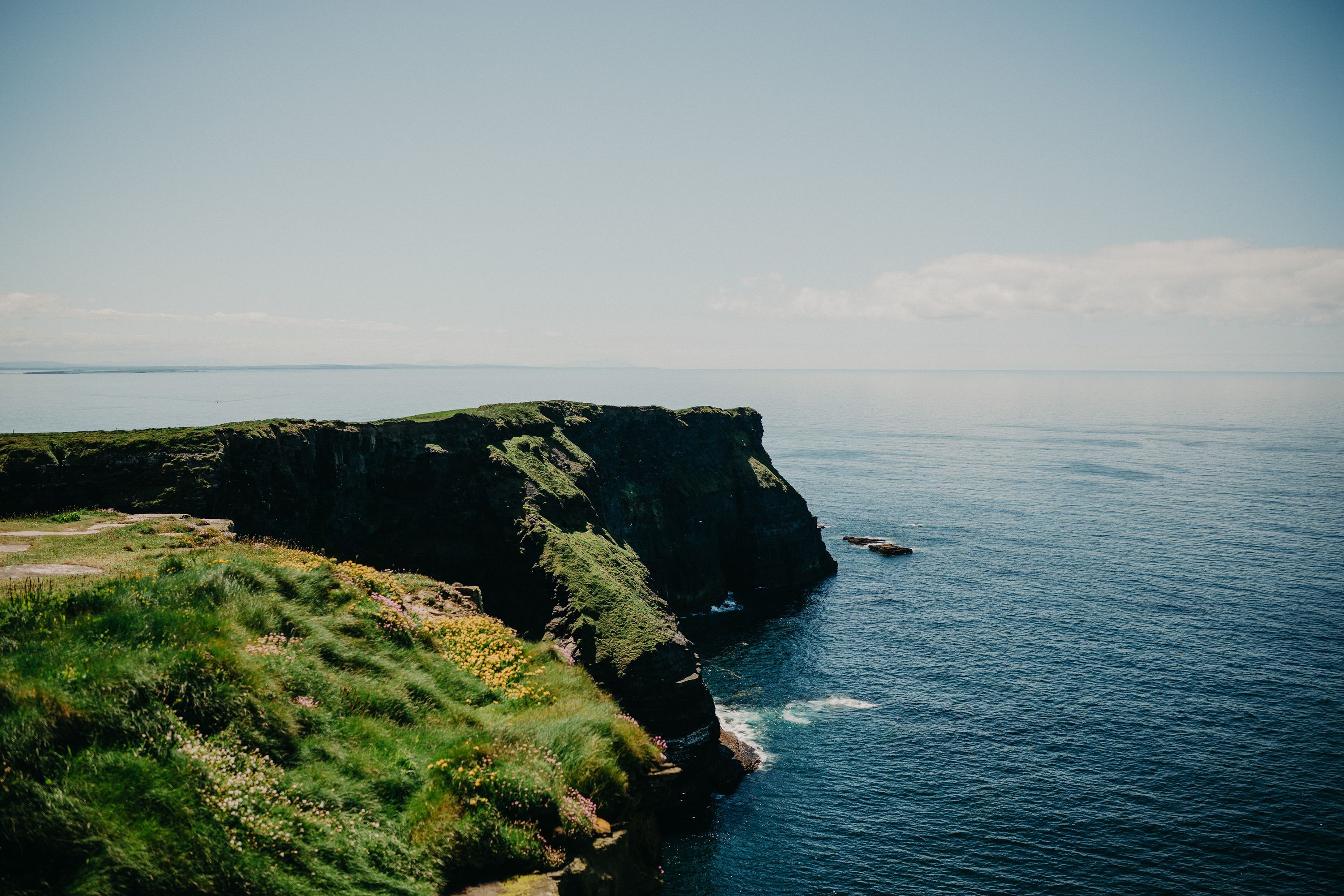A grassy cliff for a small wedding in Ireland with amazing views of the sea
