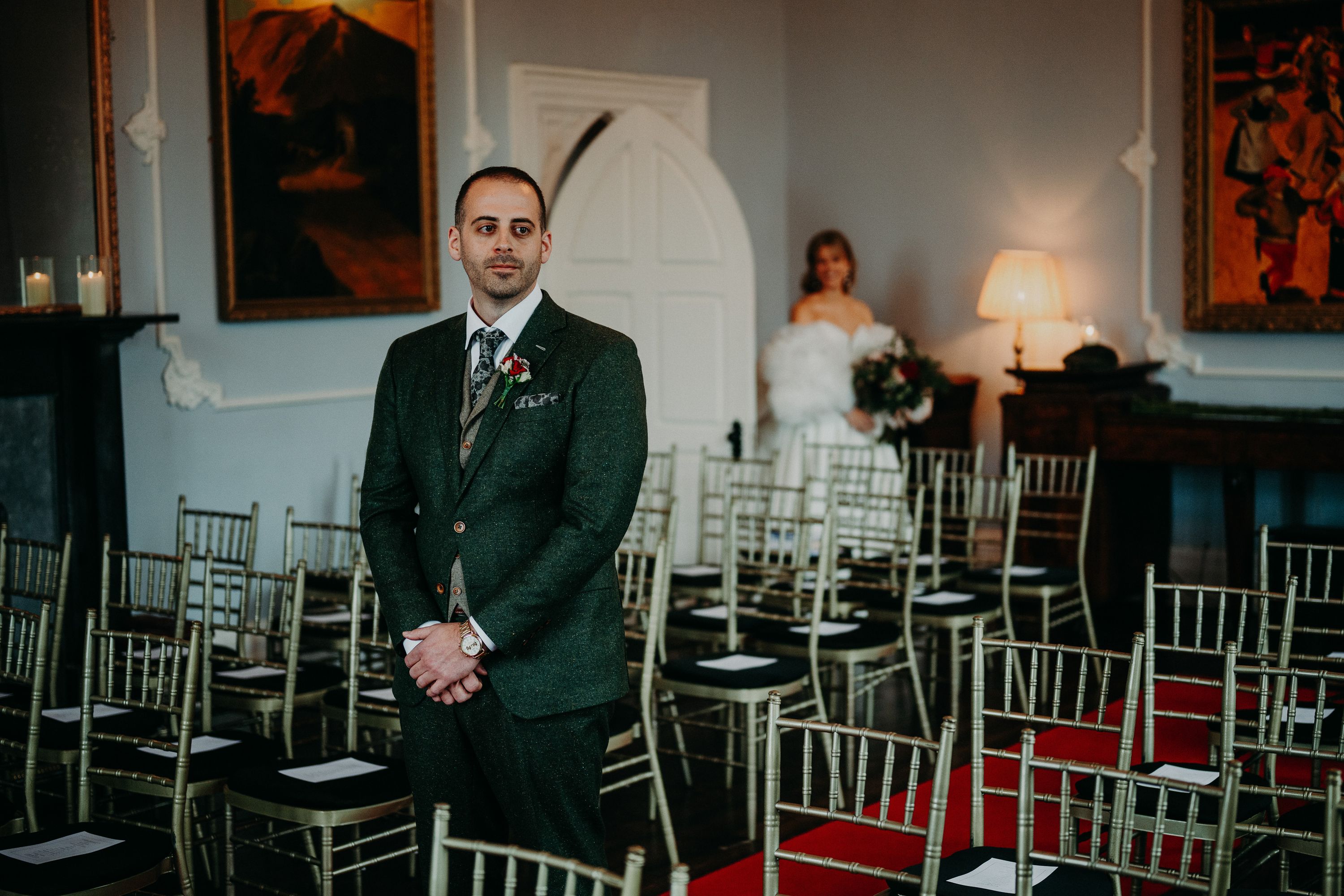 Groom waiting at the ceremony with the bride arriving for an intimate wedding in Ireland