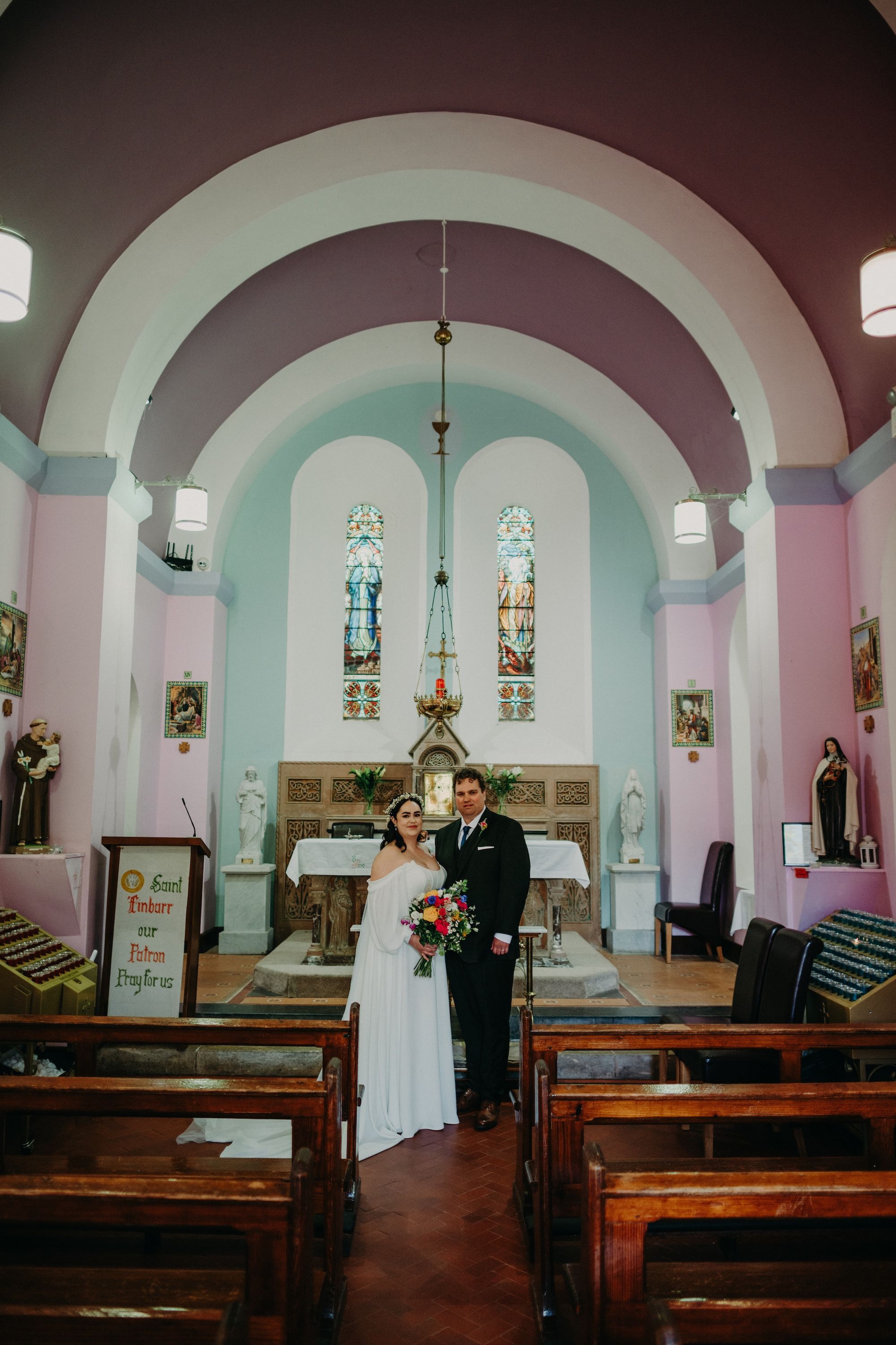 Bride and groom inside a chapel in Cork where they had an intimate wedding in Ireland