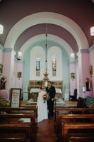Bride and groom inside a chapel in Cork where they had an intimate wedding in Ireland