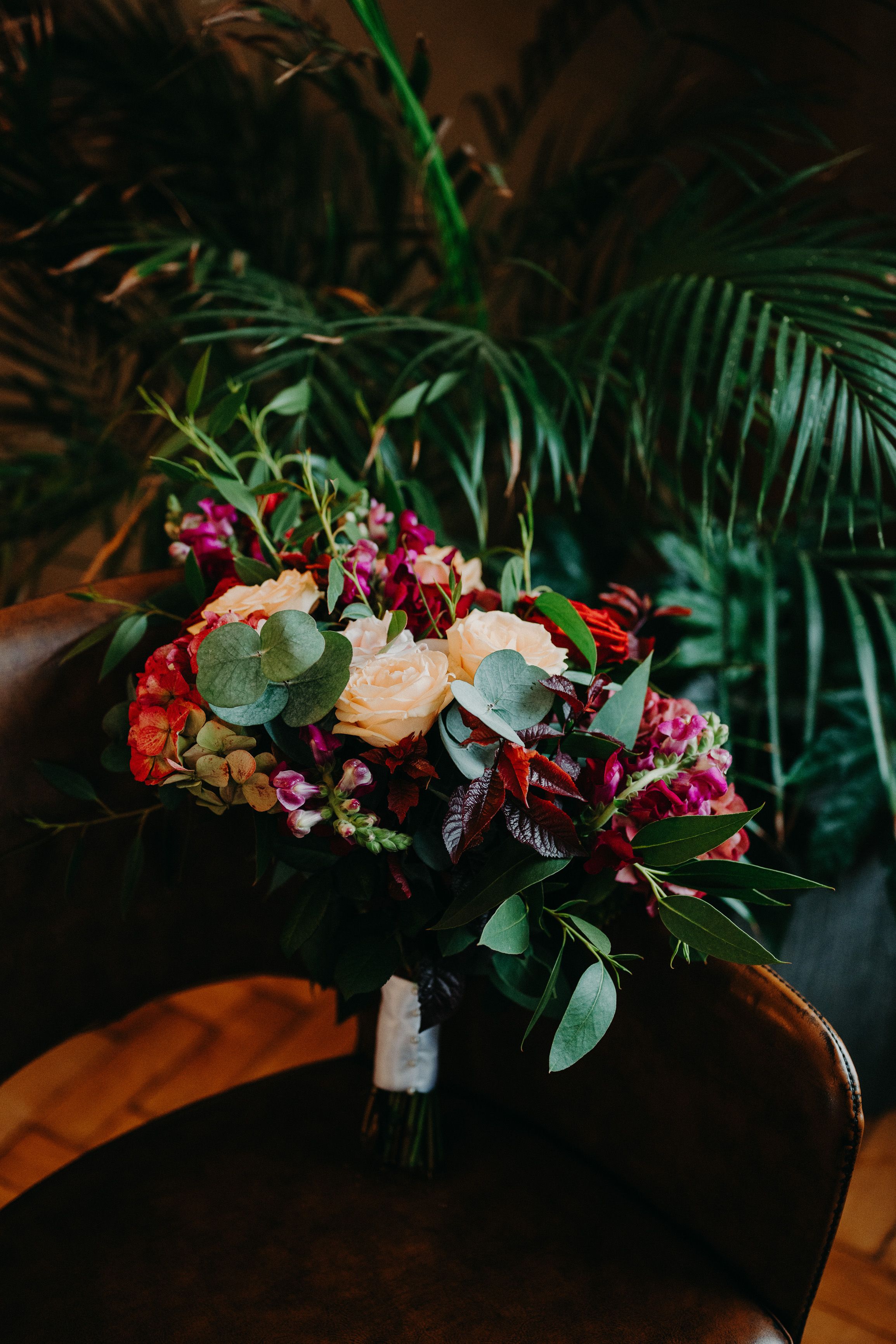 Vibrant bridal bouquet with roses and greenery styled for an intimate wedding in Ireland