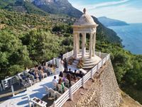 Bride and groom having a ceremony at a clifftop spot in Mallorca for their Spanish destination wedding