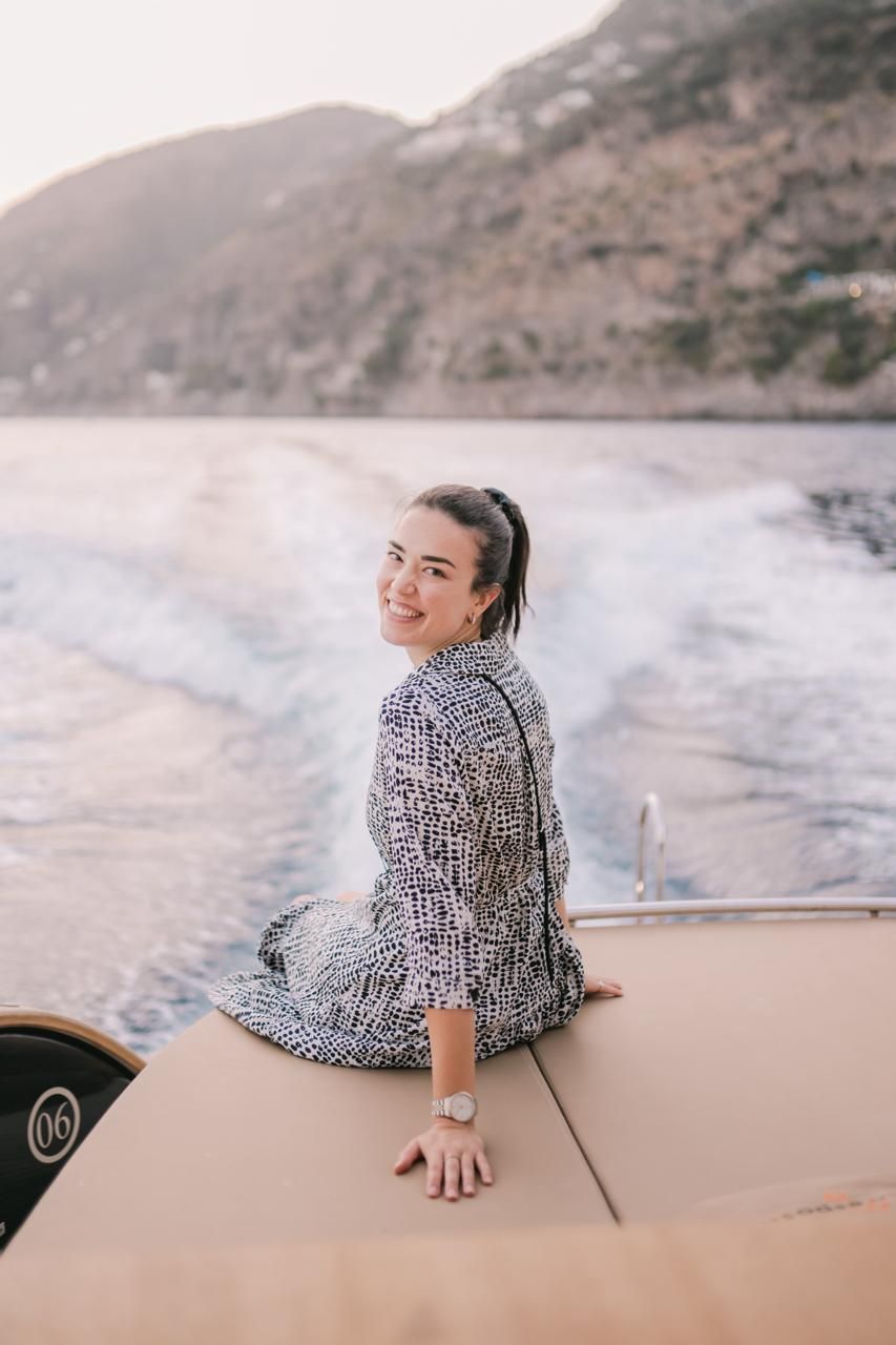 Destination wedding planner, Eleonora, posing on a boat in Italy