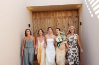 Bride with her family walking during the wedding preparation photoshoot of her destination wedding in Portugal