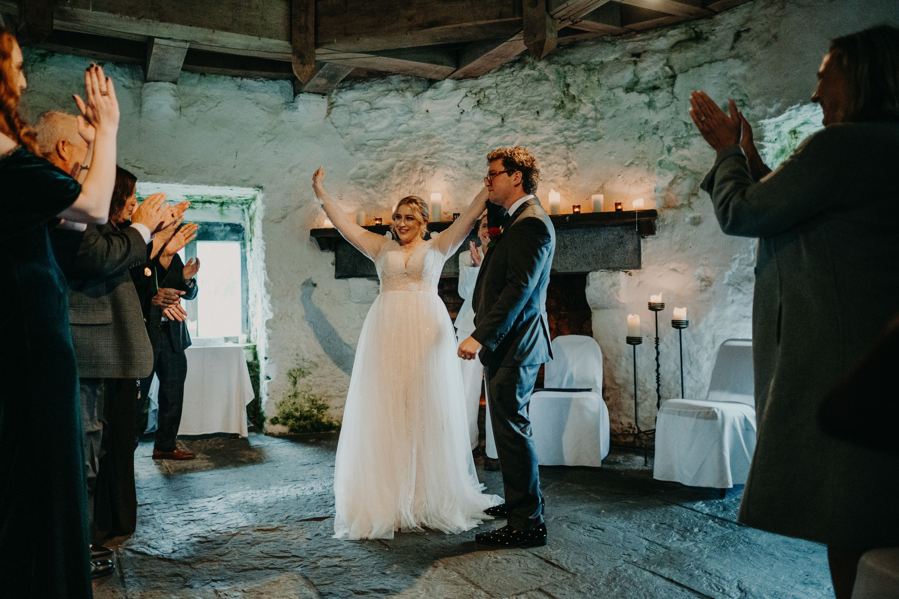 Guests applauding the newly married couple at a small wedding in Ireland