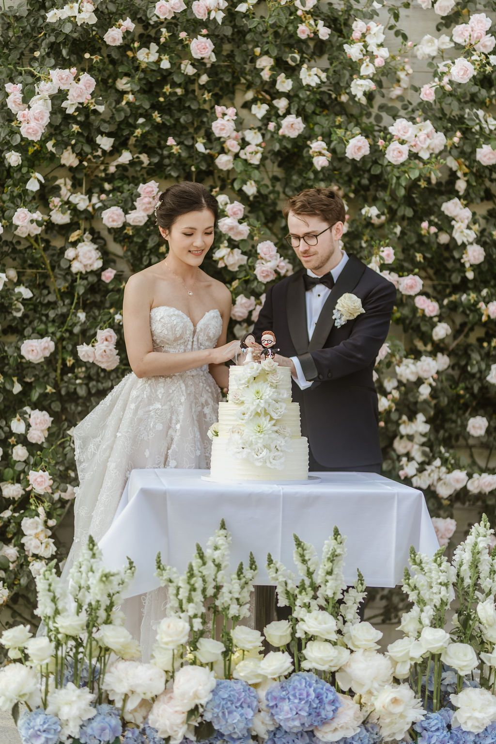 A bride and groom cutting their cake during a small wedding in Switzerland