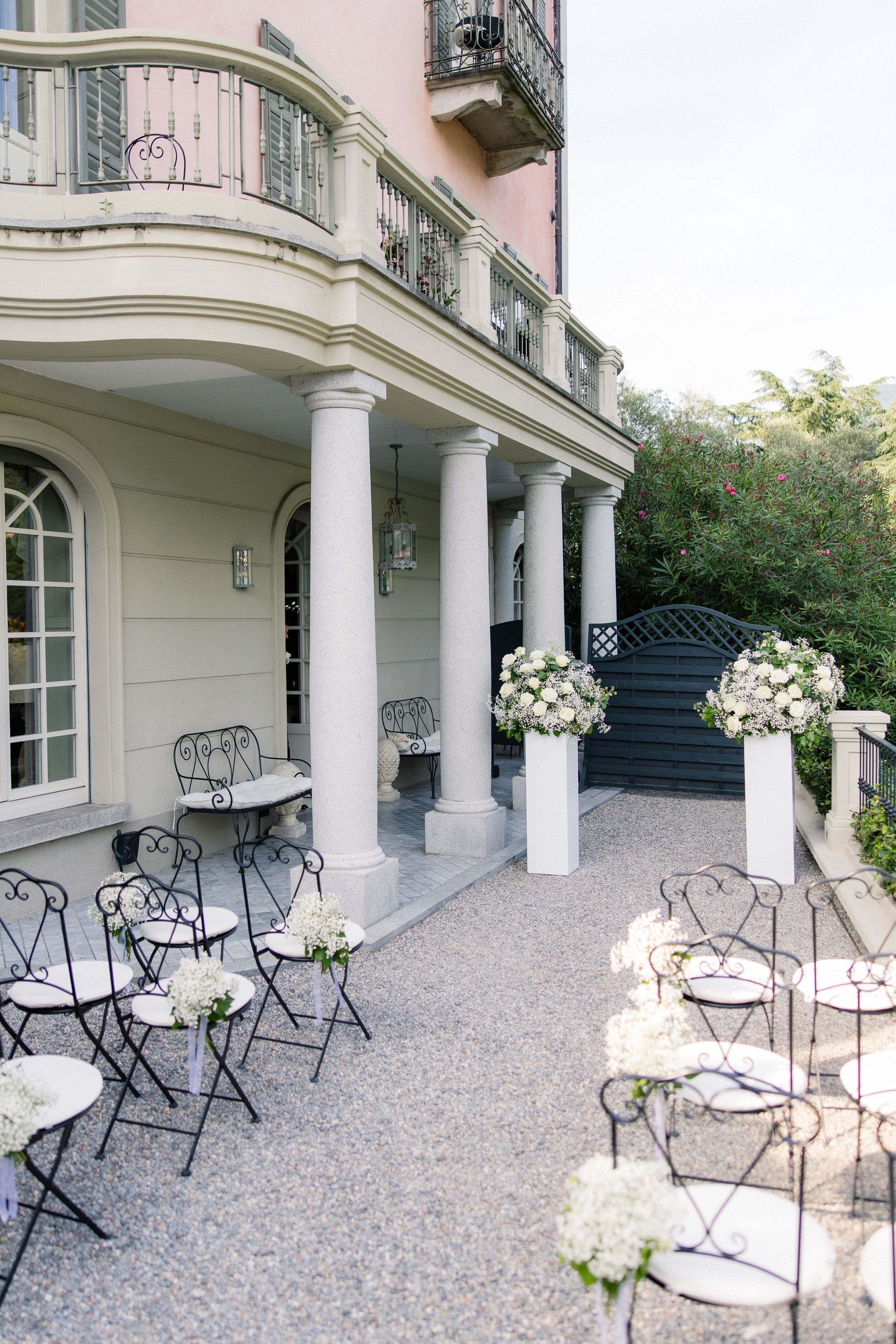Elegant outdoor ceremony setup with floral arrangements at a Lake Como intimate wedding in Italy