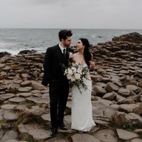 Bride and grom posing at Giant's Causeway in Northern Ireland