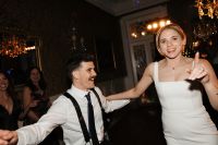 Newlyweds dancing in the middle of the dance floor as guests cheered for them during their destination wedding in Portugal