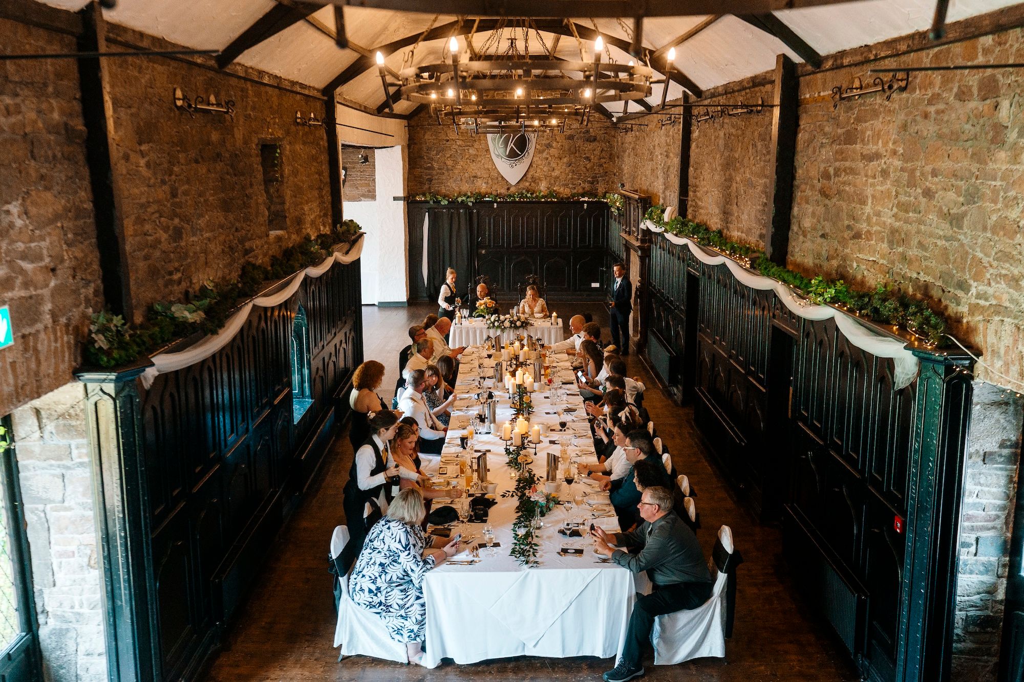 An elegant reception in a castle's banquet hall for a micro wedding in Ireland