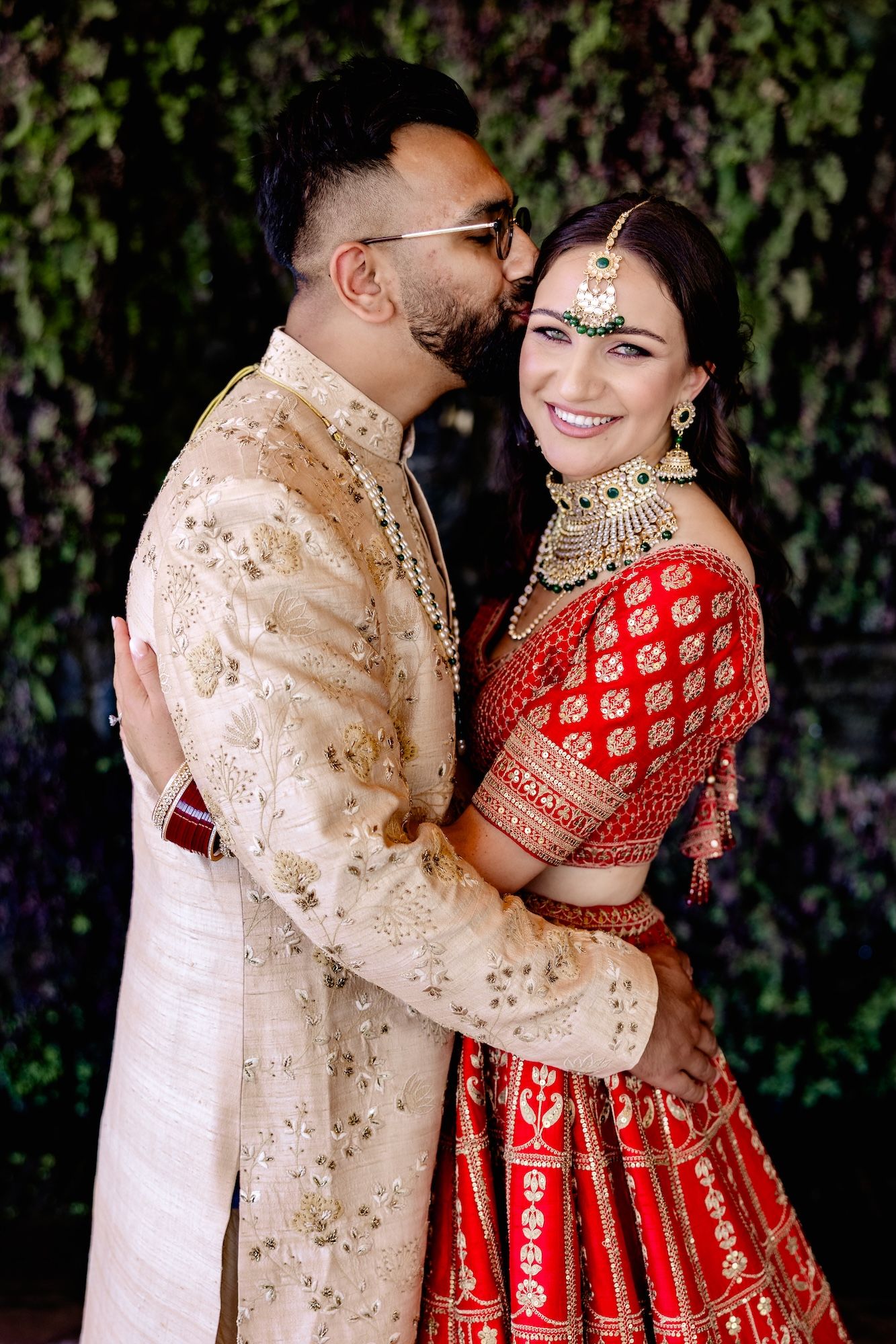 Bride and groom in Hindu wedding attire having a romantic photoshoot when they got married in Spain