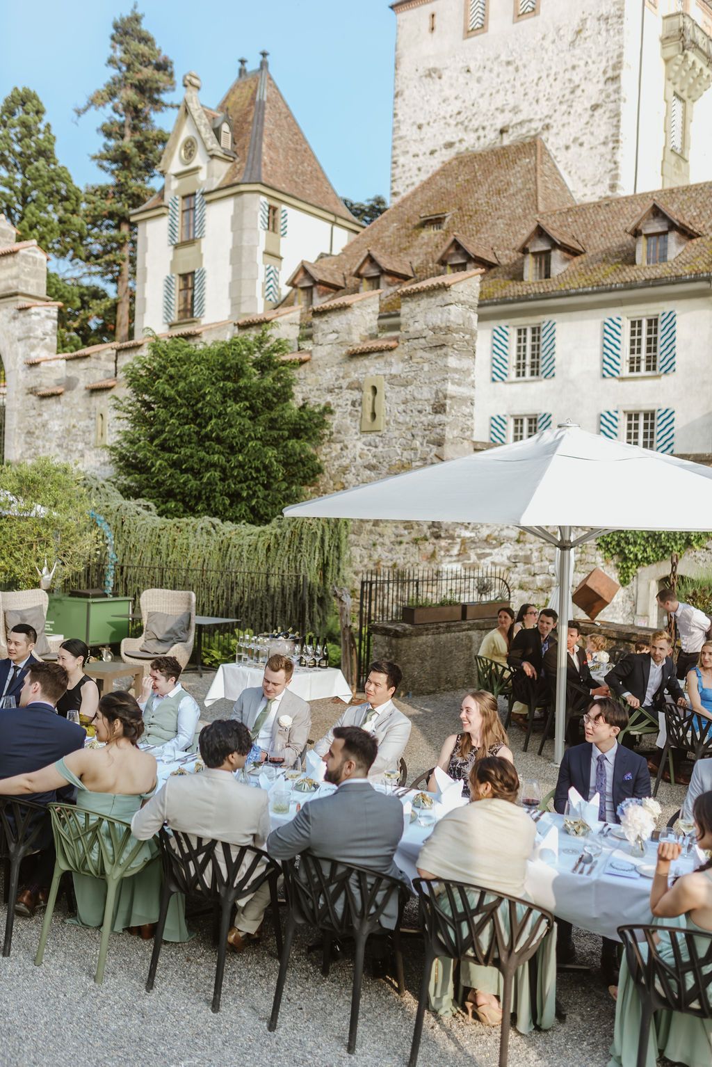 A group of people celebrating a bride and groom's intimate wedding in Switzerland