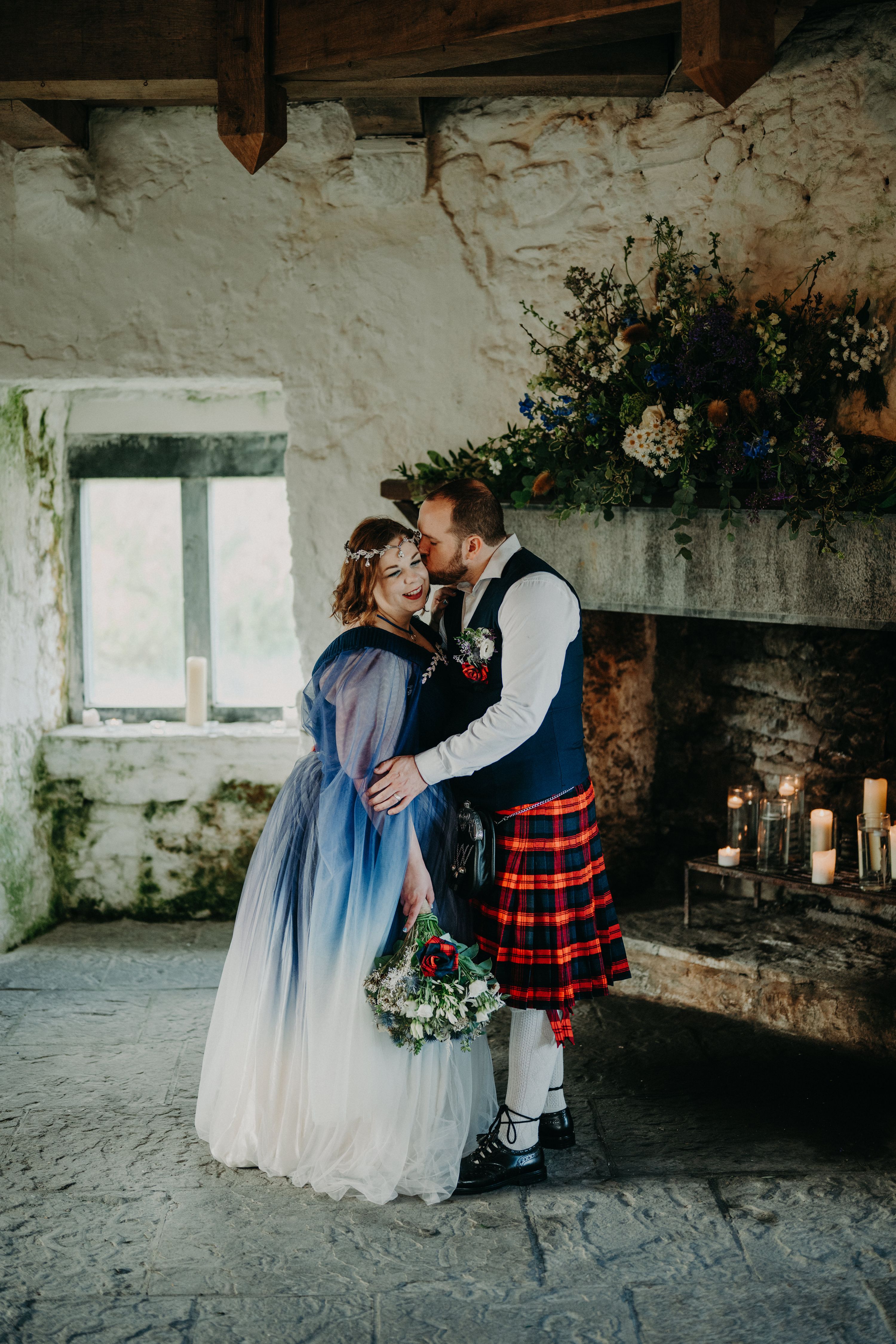 Newlyweds inside a historic castle tower after the ceremony of their elopement in Ireland