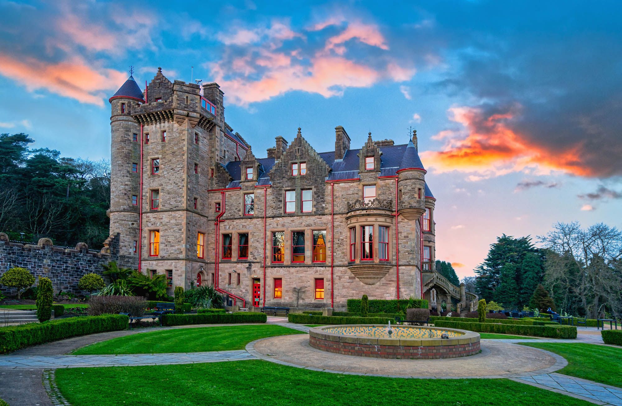Historical looking castle with lush greenery outside in United Kingdom
