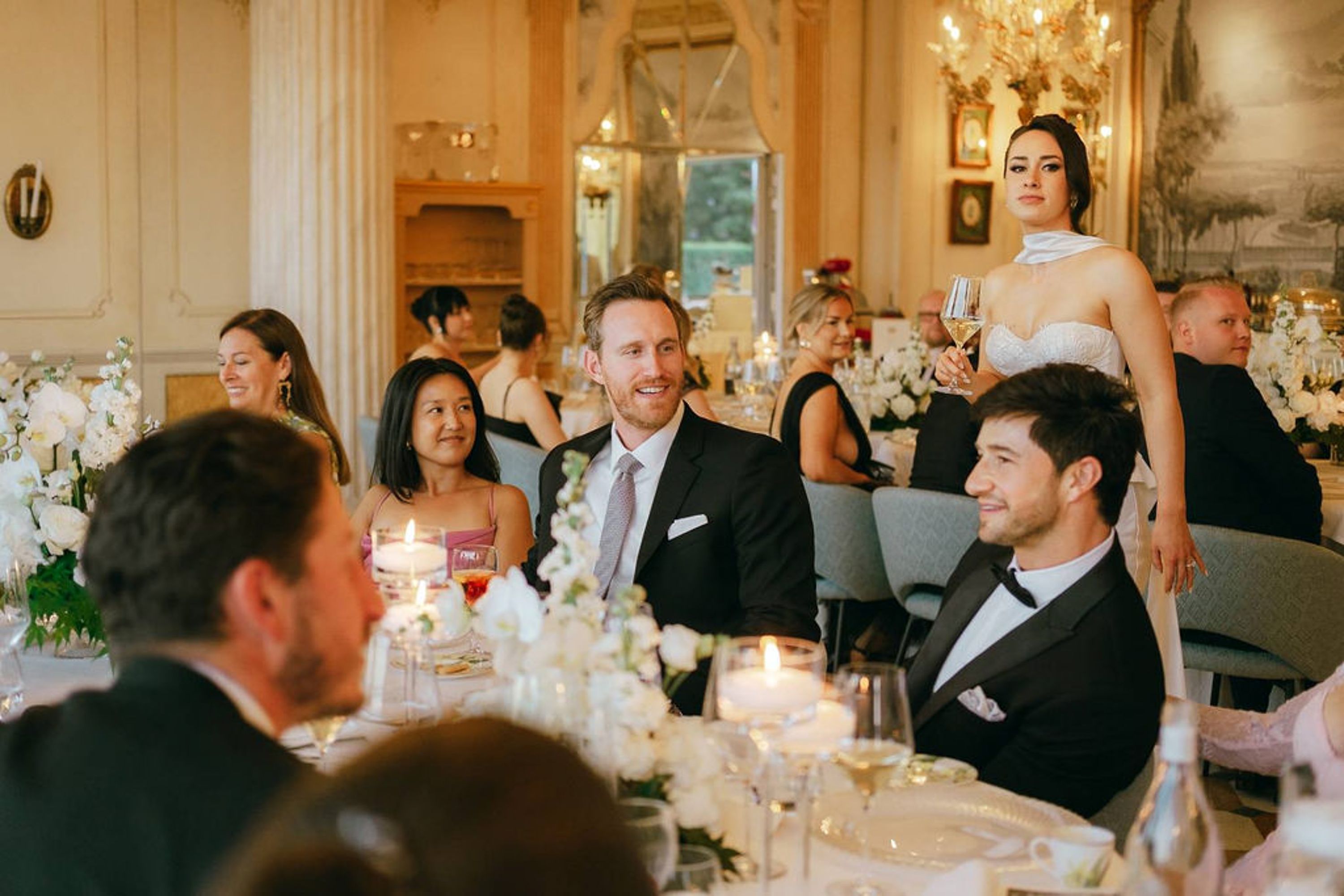 Bride addressing guests during a heartfelt speech at a small wedding in Italy
