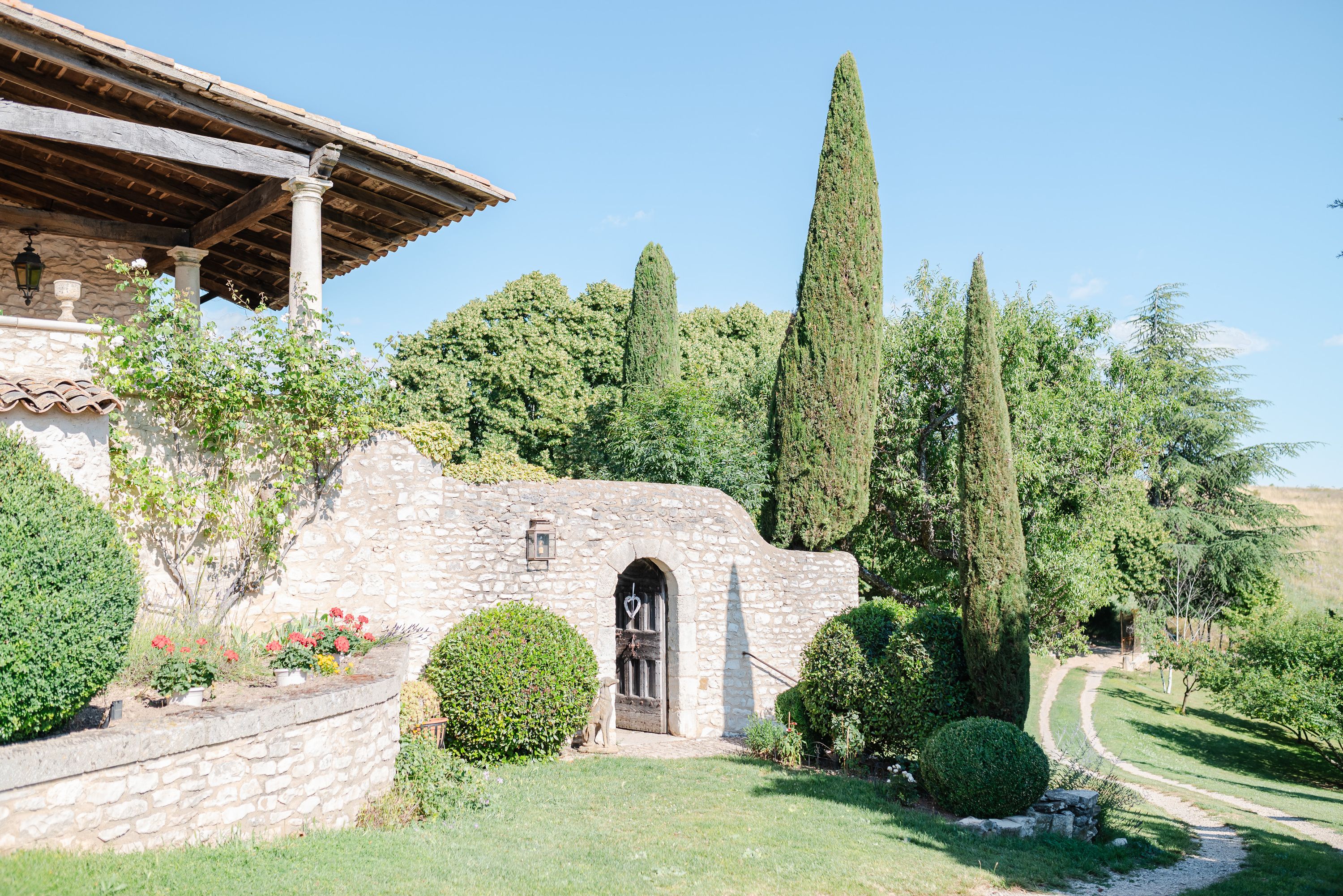 A beautiful chateau with stone walls and tall trees for a micro wedding in France