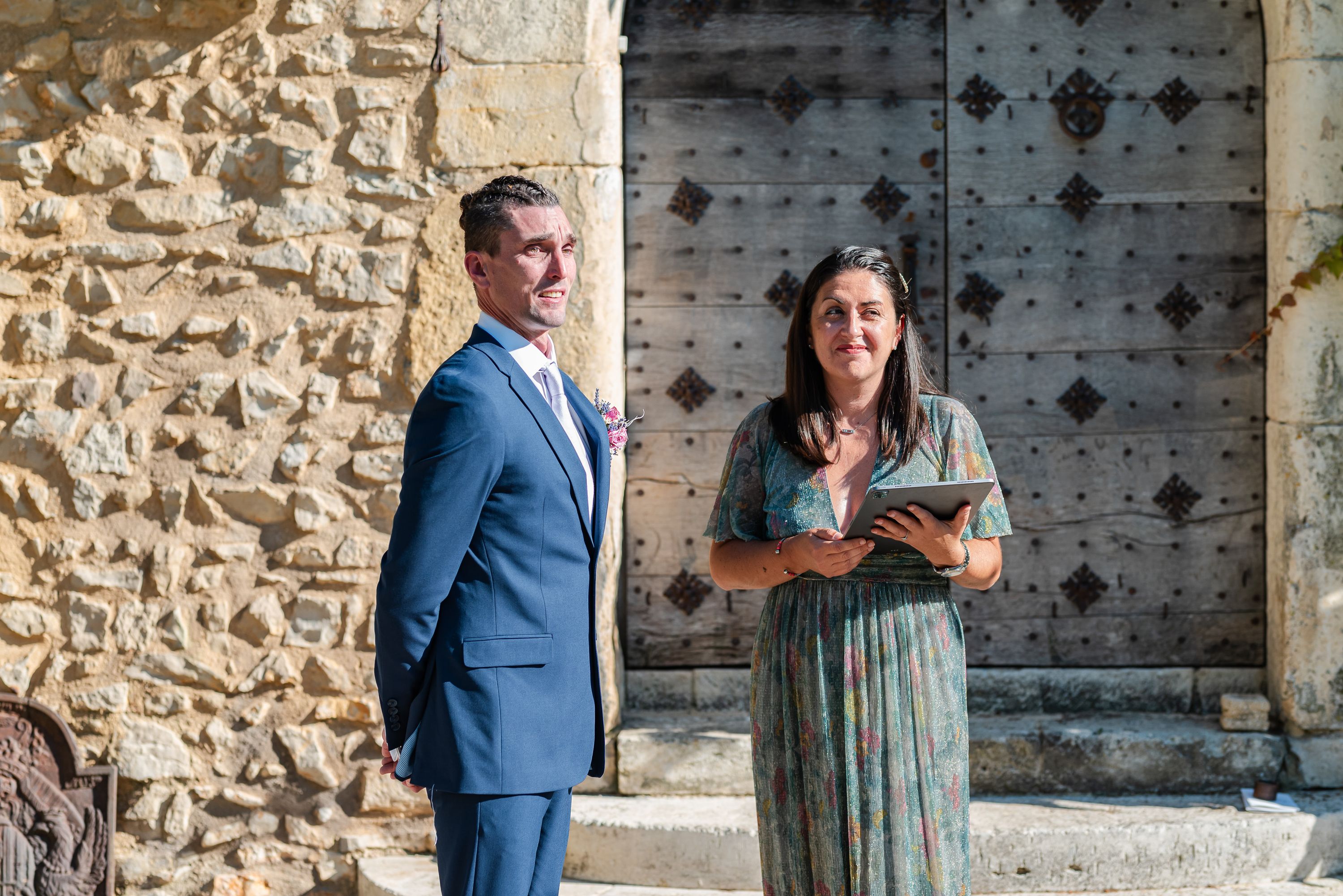 Groom waiting with celebrant before the ceremony at an intimate wedding in France