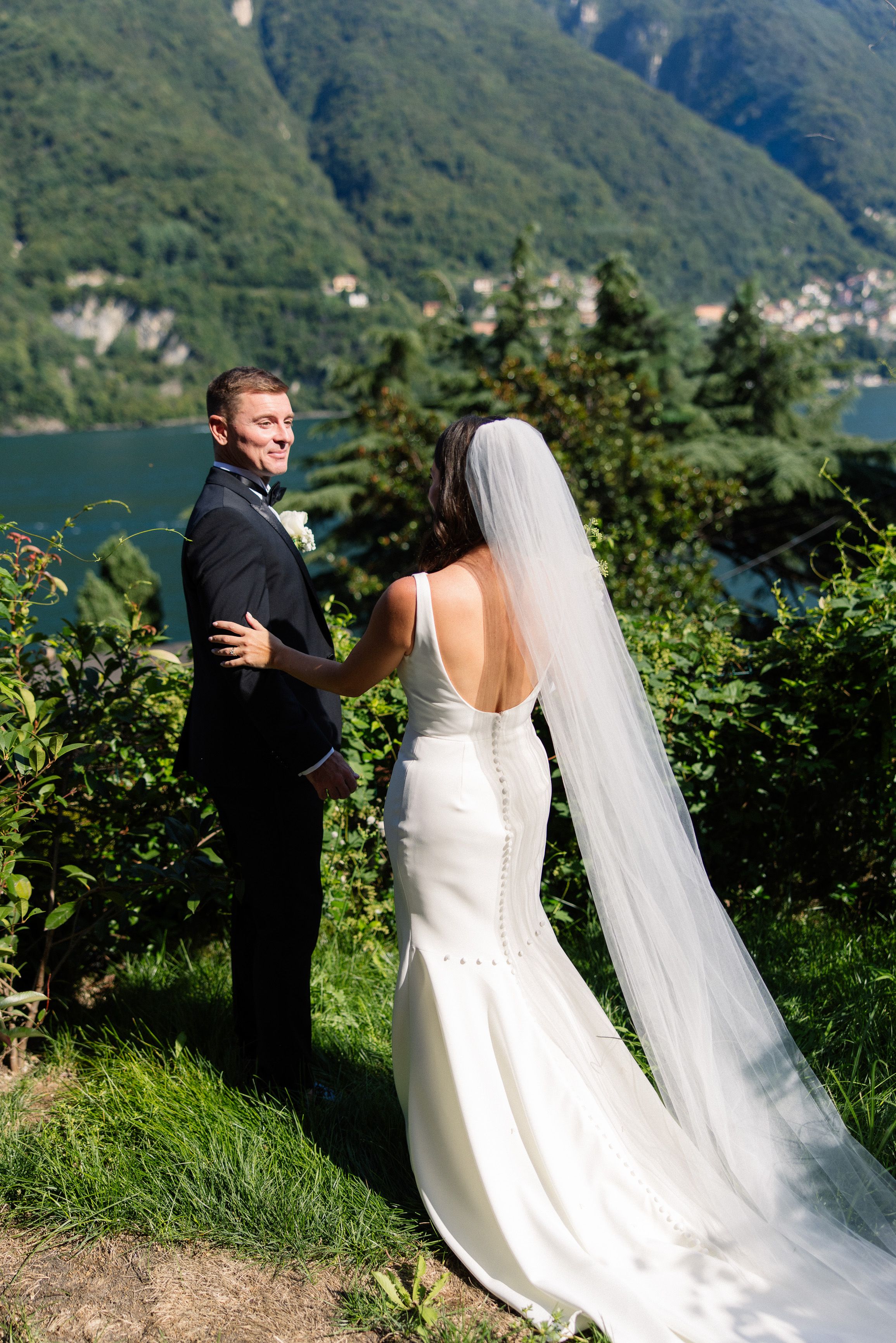 Newlyweds admiring Lake Como scenery during an intimate wedding in Italy celebration