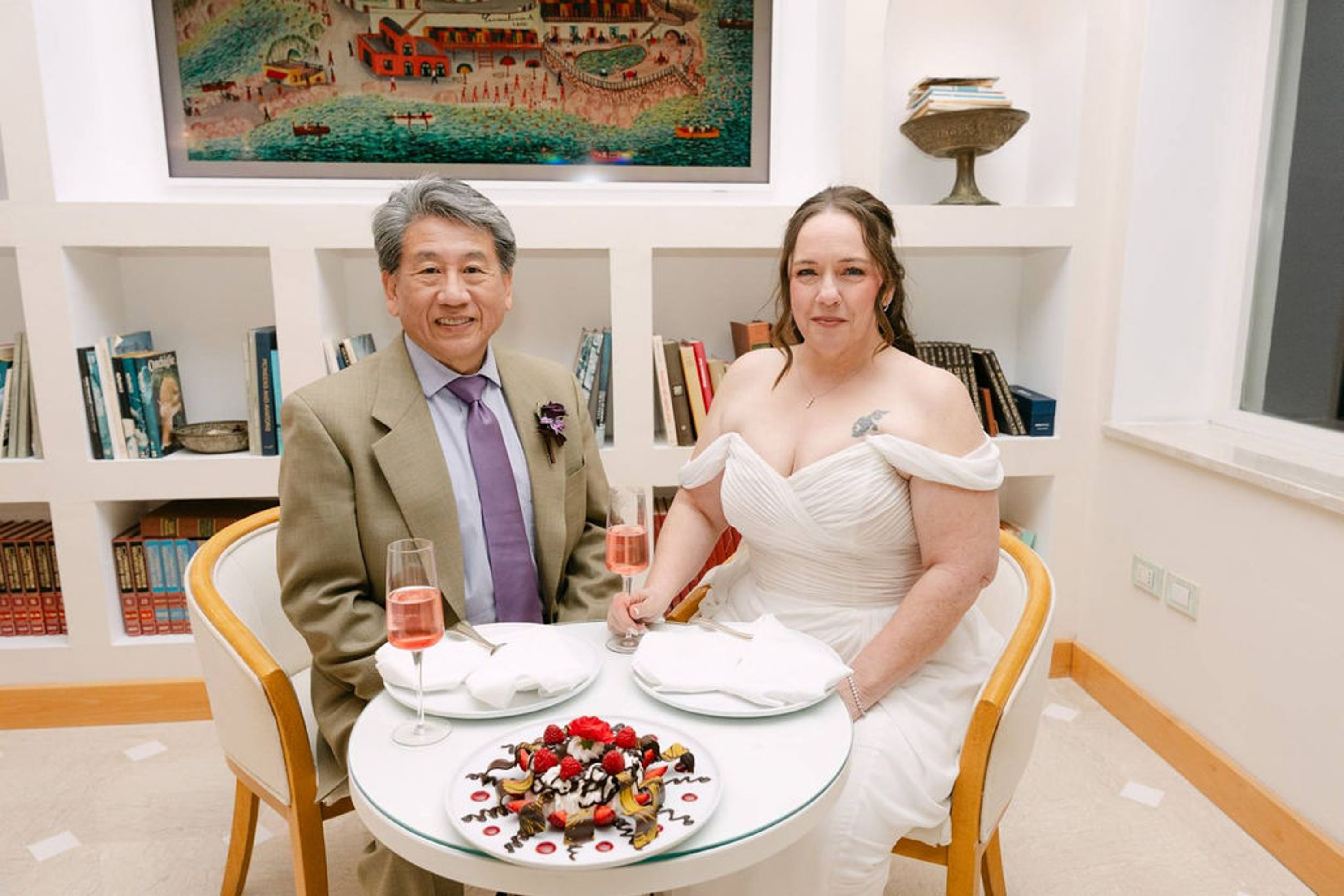 Newlyweds enjoy a romantic dessert and champagne toast at an intimate wedding in Italy