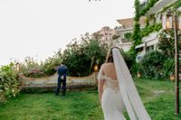 Bride is walking towards her groom during the first look of their destination elopement in Italy on the Amalfi Coast
